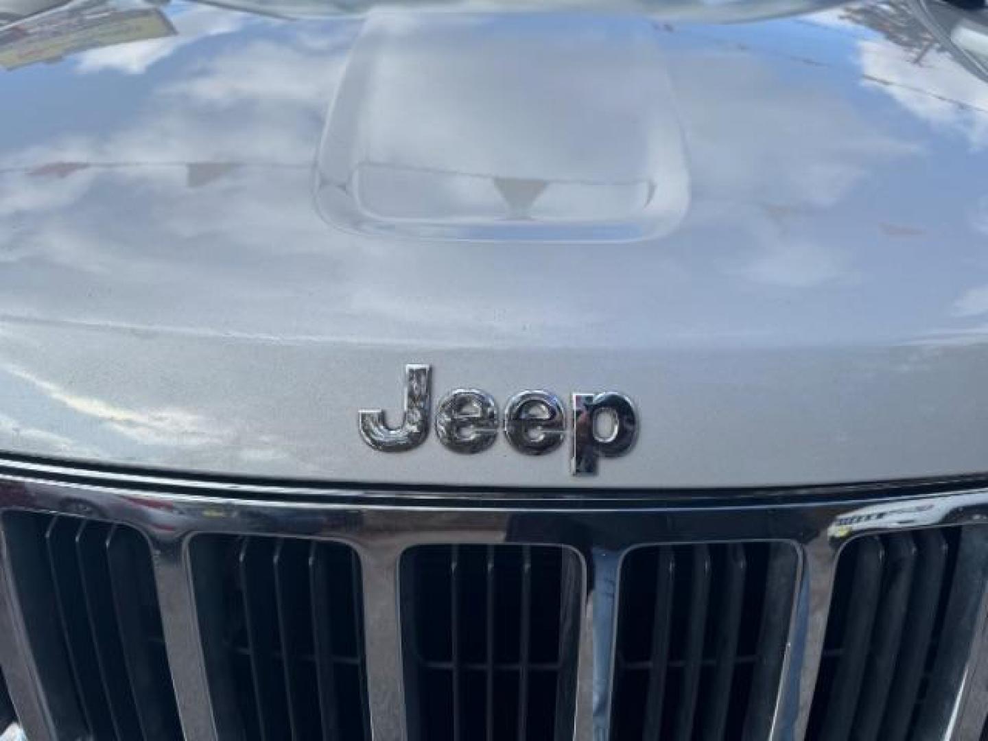 2012 Silver Jeep Grand Cherokee Laredo 2WD (1C4RJEAG6CC) with an 3.6L V6 DOHC 24V engine, 5-Speed Automatic transmission, located at 1806 Veterans Memorial Hwy SW, Austell, GA, 30168, (770) 944-9558, 33.817959, -84.606987 - Photo#17