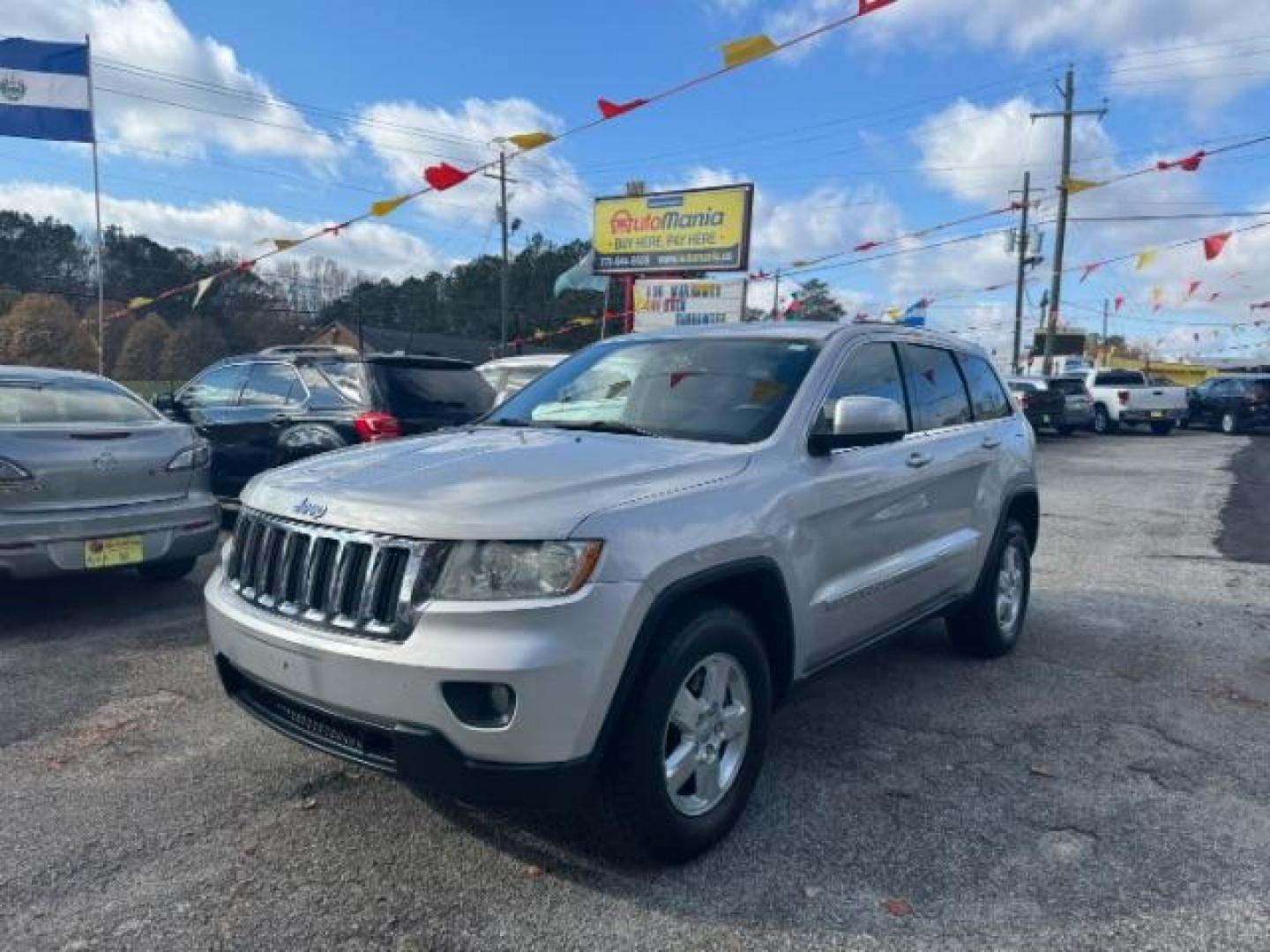 2012 Silver Jeep Grand Cherokee Laredo 2WD (1C4RJEAG6CC) with an 3.6L V6 DOHC 24V engine, 5-Speed Automatic transmission, located at 1806 Veterans Memorial Hwy SW, Austell, GA, 30168, (770) 944-9558, 33.817959, -84.606987 - Photo#0