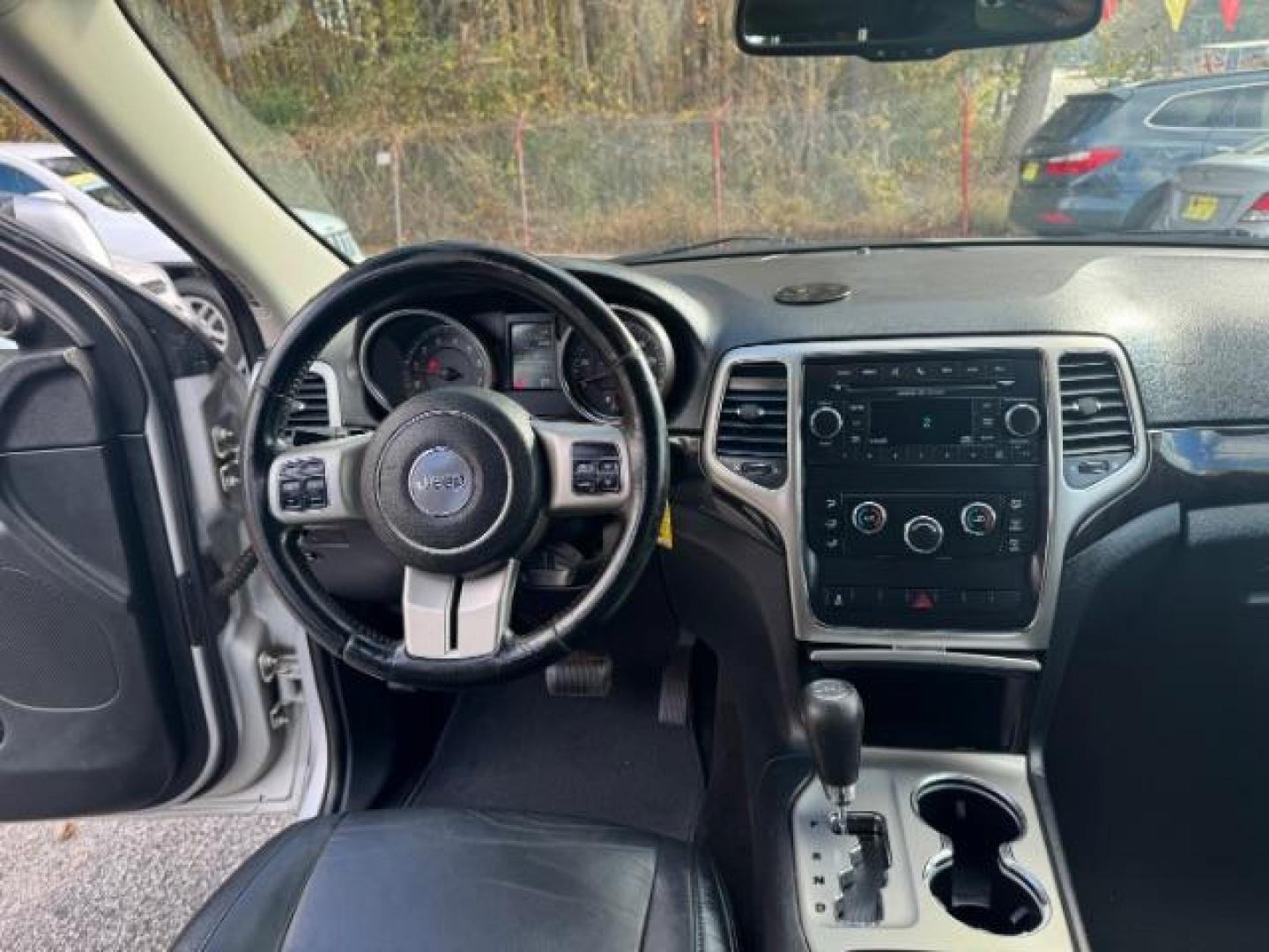 2012 Silver Jeep Grand Cherokee Laredo 2WD (1C4RJEAG6CC) with an 3.6L V6 DOHC 24V engine, 5-Speed Automatic transmission, located at 1806 Veterans Memorial Hwy SW, Austell, GA, 30168, (770) 944-9558, 33.817959, -84.606987 - Photo#18