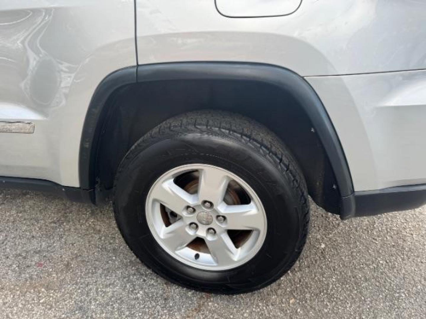 2012 Silver Jeep Grand Cherokee Laredo 2WD (1C4RJEAG6CC) with an 3.6L V6 DOHC 24V engine, 5-Speed Automatic transmission, located at 1806 Veterans Memorial Hwy SW, Austell, GA, 30168, (770) 944-9558, 33.817959, -84.606987 - Photo#22