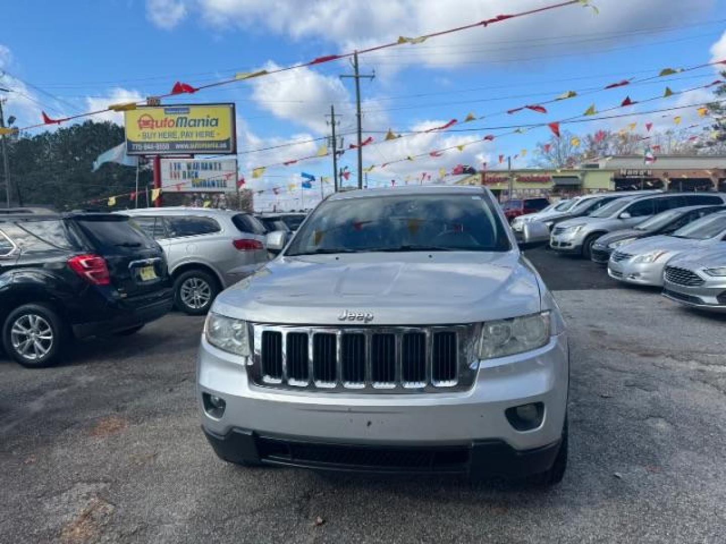 2012 Silver Jeep Grand Cherokee Laredo 2WD (1C4RJEAG6CC) with an 3.6L V6 DOHC 24V engine, 5-Speed Automatic transmission, located at 1806 Veterans Memorial Hwy SW, Austell, GA, 30168, (770) 944-9558, 33.817959, -84.606987 - Photo#1