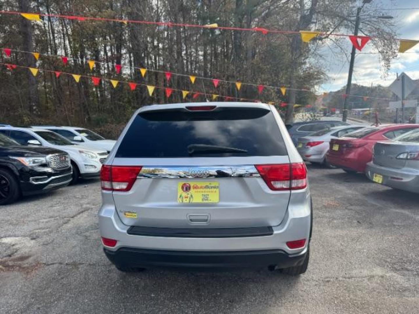 2012 Silver Jeep Grand Cherokee Laredo 2WD (1C4RJEAG6CC) with an 3.6L V6 DOHC 24V engine, 5-Speed Automatic transmission, located at 1806 Veterans Memorial Hwy SW, Austell, GA, 30168, (770) 944-9558, 33.817959, -84.606987 - Photo#3