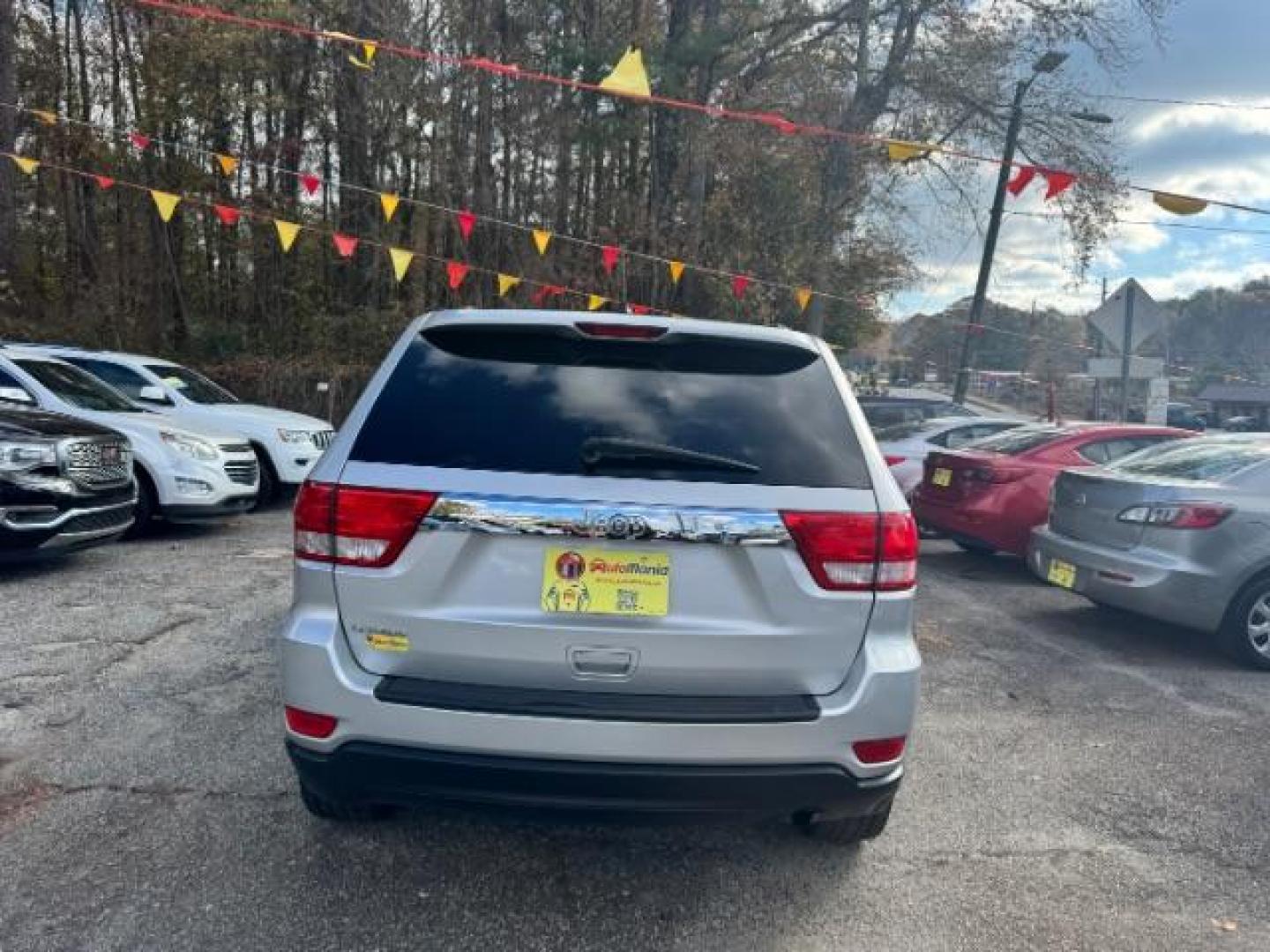 2012 Silver Jeep Grand Cherokee Laredo 2WD (1C4RJEAG6CC) with an 3.6L V6 DOHC 24V engine, 5-Speed Automatic transmission, located at 1806 Veterans Memorial Hwy SW, Austell, GA, 30168, (770) 944-9558, 33.817959, -84.606987 - Photo#5