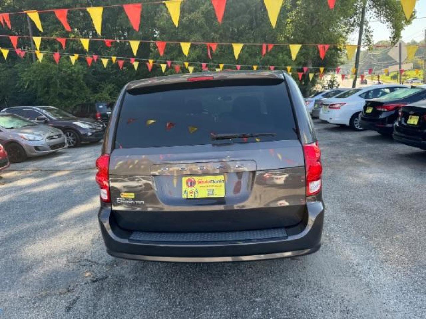 2016 Gray Dodge Grand Caravan SE Plus (2C4RDGBG6GR) with an 3.6L V6 DOHC 24V engine, 6-Speed Automatic transmission, located at 1806 Veterans Memorial Hwy SW, Austell, GA, 30168, (770) 944-9558, 33.817959, -84.606987 - Photo#4