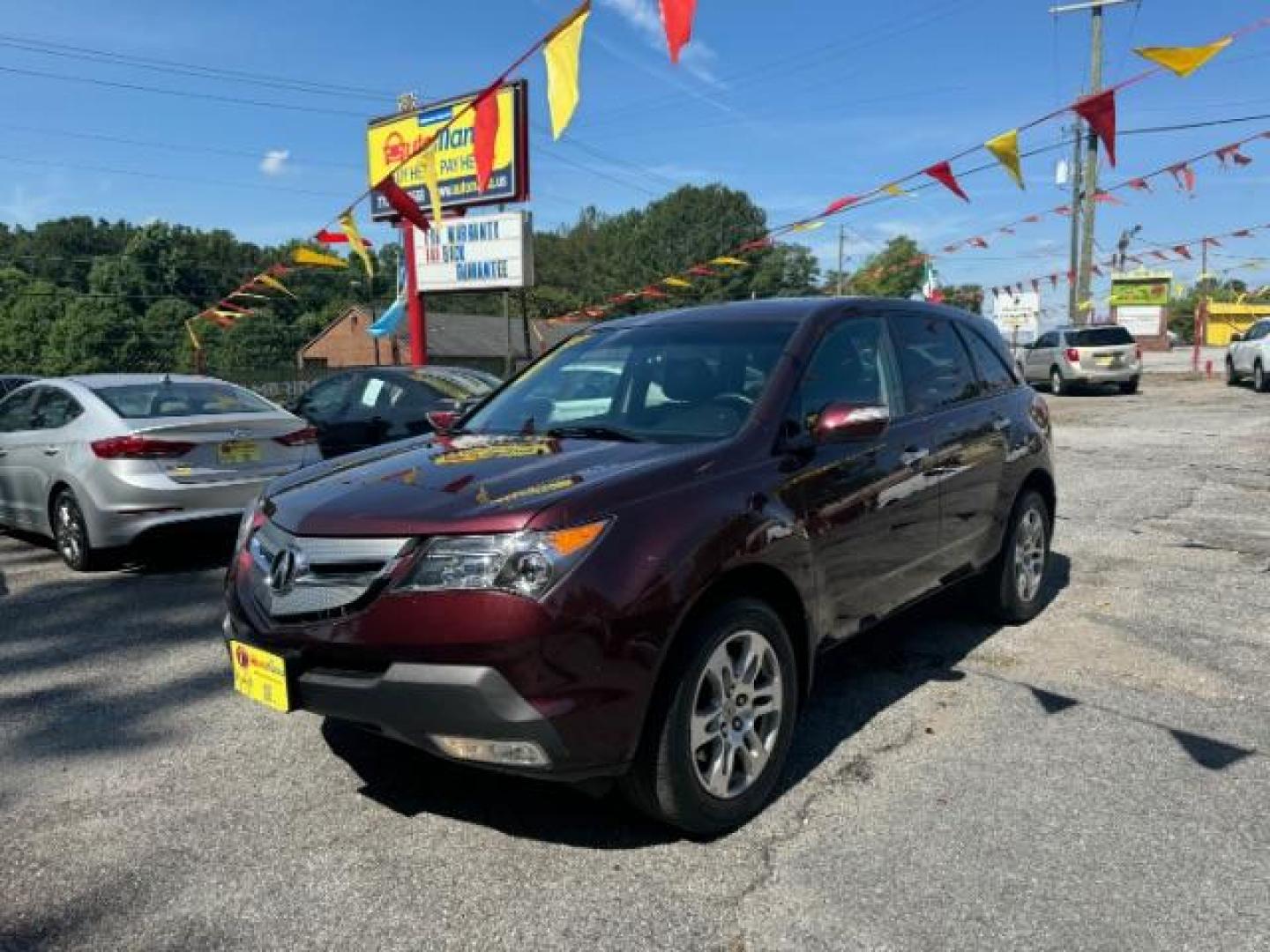 2009 Maroon Acura MDX Base (2HNYD282X9H) with an 3.7L V6 SOHC 24V engine, 5-Speed Automatic transmission, located at 1806 Veterans Memorial Hwy SW, Austell, GA, 30168, (770) 944-9558, 33.817959, -84.606987 - Photo#0