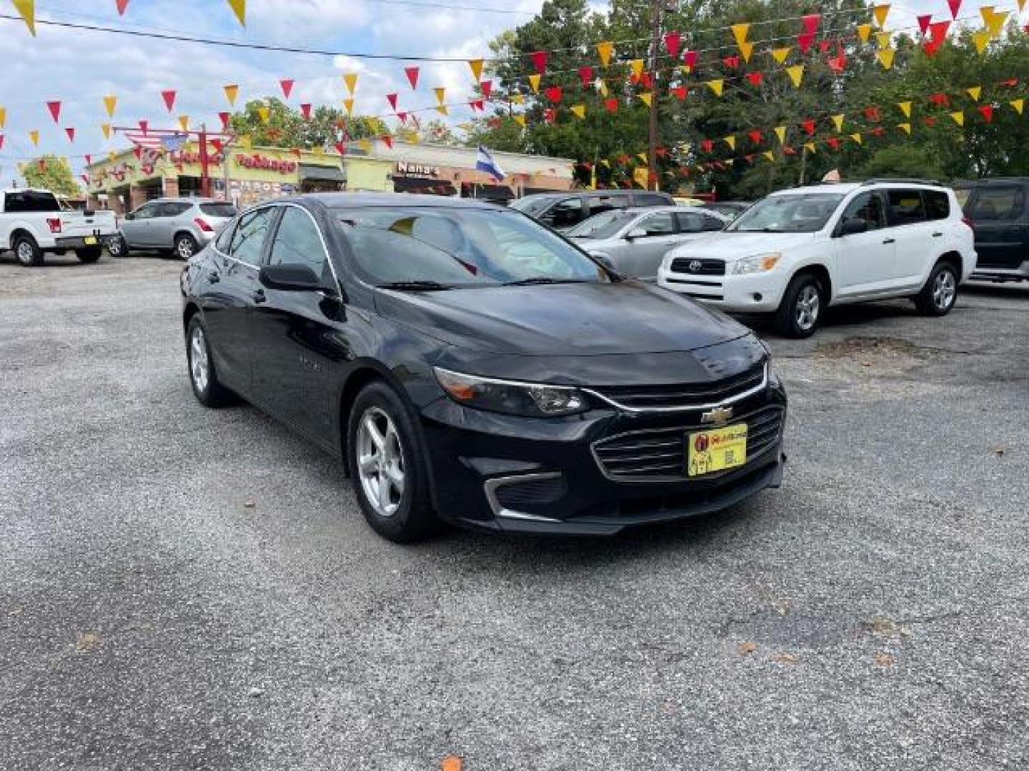 2016 Black Chevrolet Malibu LS (1G1ZB5ST9GF) with an 1.5L L4 DOHC 16V engine, 6-Speed Automatic transmission, located at 1806 Veterans Memorial Hwy SW, Austell, GA, 30168, (770) 944-9558, 33.817959, -84.606987 - Photo#2