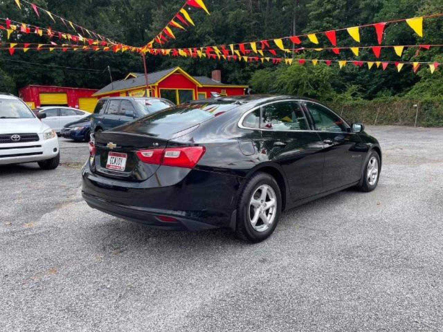 2016 Black Chevrolet Malibu LS (1G1ZB5ST9GF) with an 1.5L L4 DOHC 16V engine, 6-Speed Automatic transmission, located at 1806 Veterans Memorial Hwy SW, Austell, GA, 30168, (770) 944-9558, 33.817959, -84.606987 - Photo#3