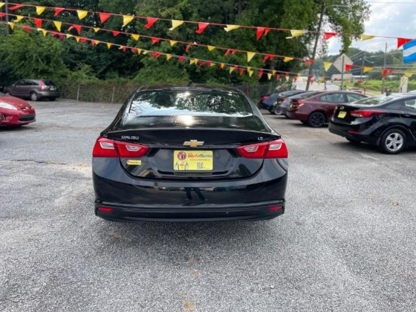 2016 Black Chevrolet Malibu LS (1G1ZB5ST9GF) with an 1.5L L4 DOHC 16V engine, 6-Speed Automatic transmission, located at 1806 Veterans Memorial Hwy SW, Austell, GA, 30168, (770) 944-9558, 33.817959, -84.606987 - Photo#4