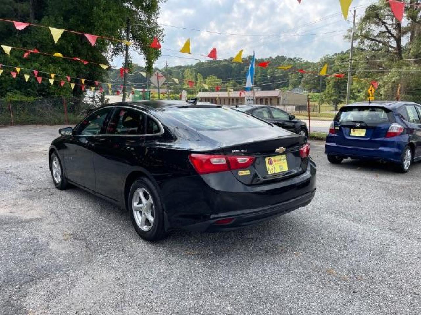 2016 Black Chevrolet Malibu LS (1G1ZB5ST9GF) with an 1.5L L4 DOHC 16V engine, 6-Speed Automatic transmission, located at 1806 Veterans Memorial Hwy SW, Austell, GA, 30168, (770) 944-9558, 33.817959, -84.606987 - Photo#5