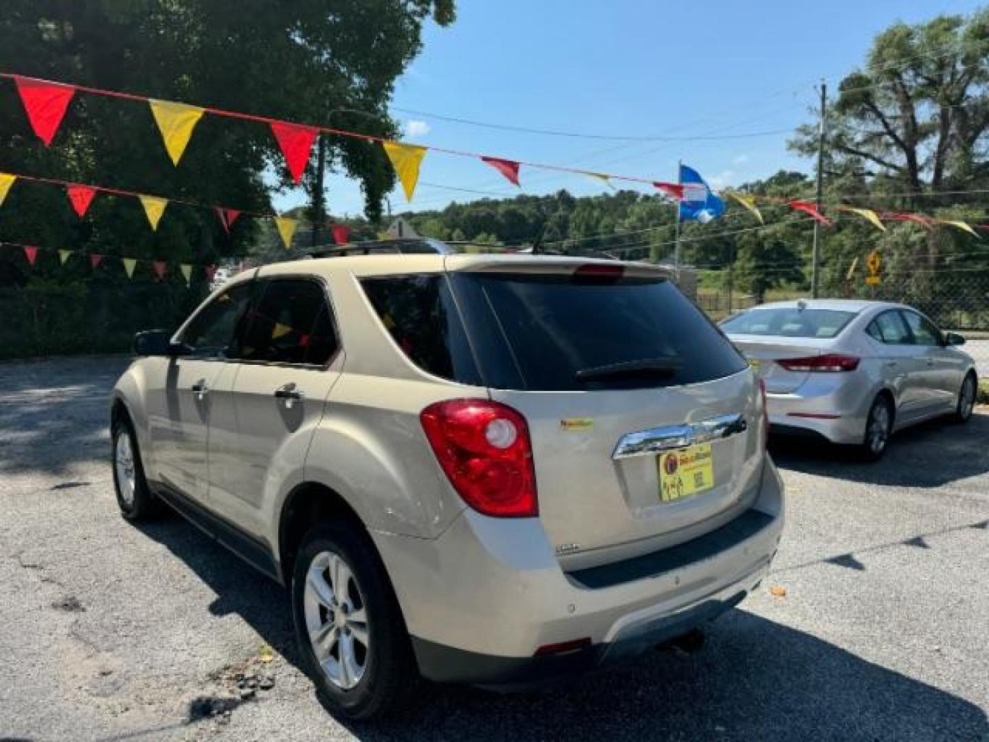 2012 Tan Chevrolet Equinox LTZ AWD (2GNFLGEK4C6) with an 2.4L L4 DOHC 16V engine, 6-Speed Automatic transmission, located at 1806 Veterans Memorial Hwy SW, Austell, GA, 30168, (770) 944-9558, 33.817959, -84.606987 - Photo#5