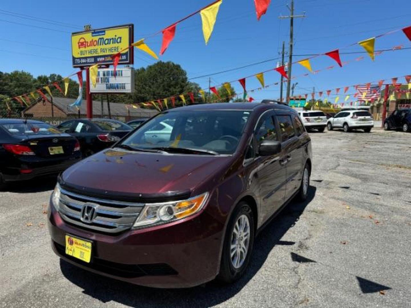 2012 Maroon Honda Odyssey EX (5FNRL5H44CB) with an 3.5L V6 SOHC 24V engine, 5-Speed Automatic transmission, located at 1806 Veterans Memorial Hwy SW, Austell, GA, 30168, (770) 944-9558, 33.817959, -84.606987 - Photo#0