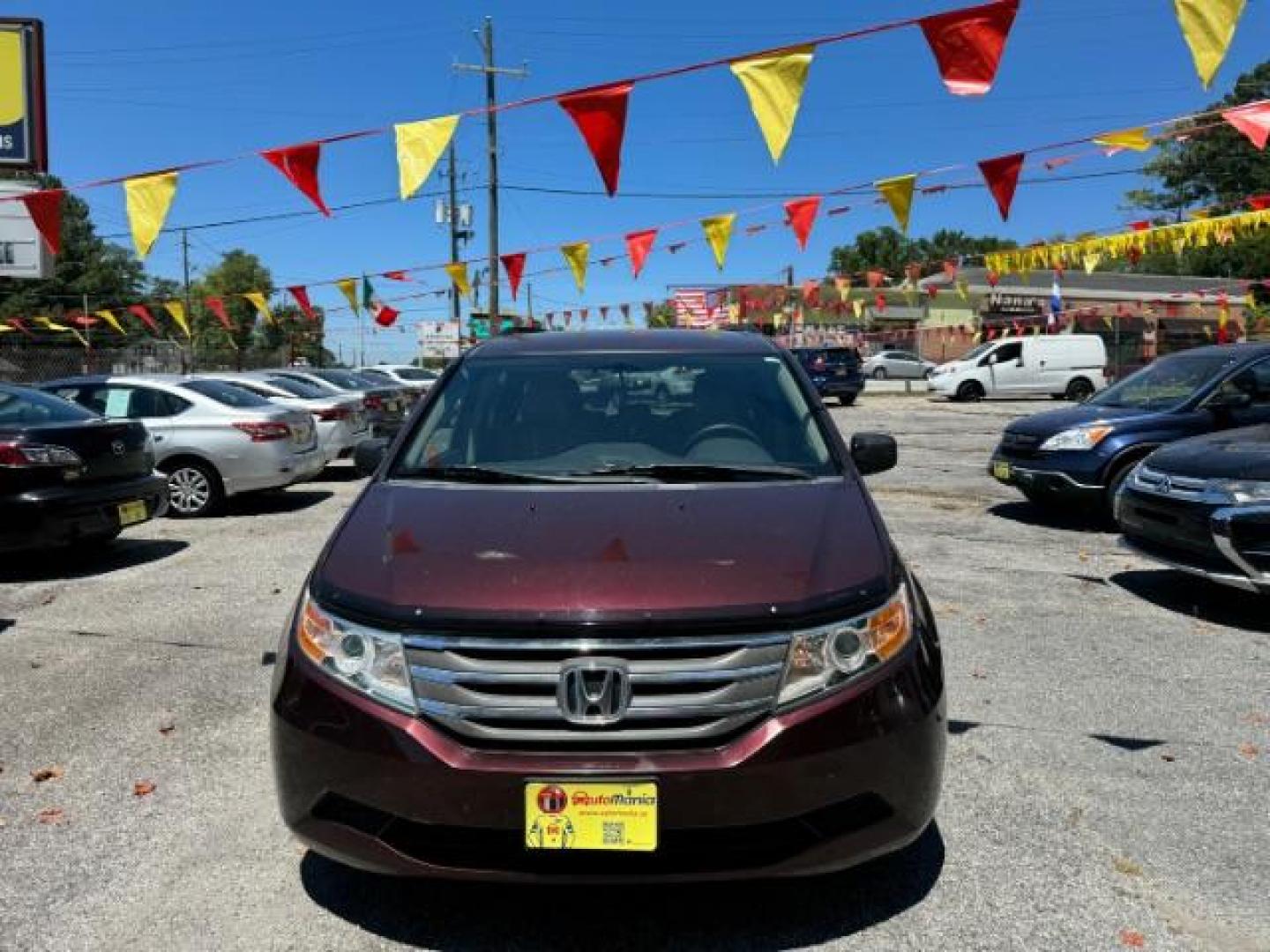 2012 Maroon Honda Odyssey EX (5FNRL5H44CB) with an 3.5L V6 SOHC 24V engine, 5-Speed Automatic transmission, located at 1806 Veterans Memorial Hwy SW, Austell, GA, 30168, (770) 944-9558, 33.817959, -84.606987 - Photo#1