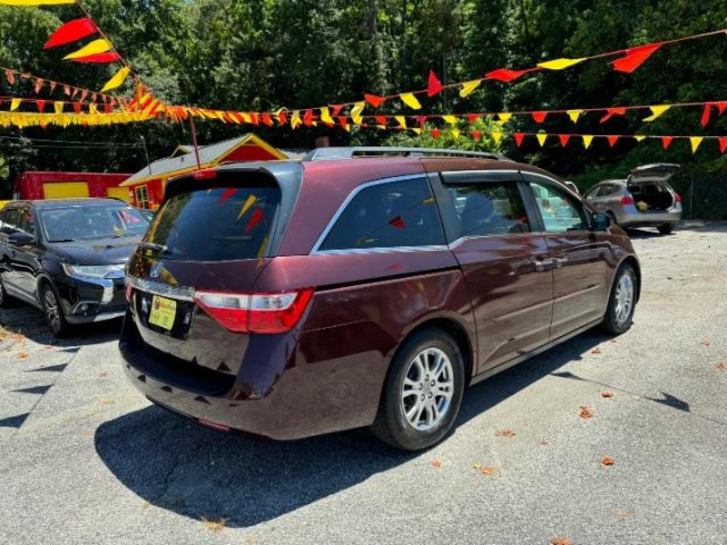 2012 Maroon Honda Odyssey EX (5FNRL5H44CB) with an 3.5L V6 SOHC 24V engine, 5-Speed Automatic transmission, located at 1806 Veterans Memorial Hwy SW, Austell, GA, 30168, (770) 944-9558, 33.817959, -84.606987 - Photo#3