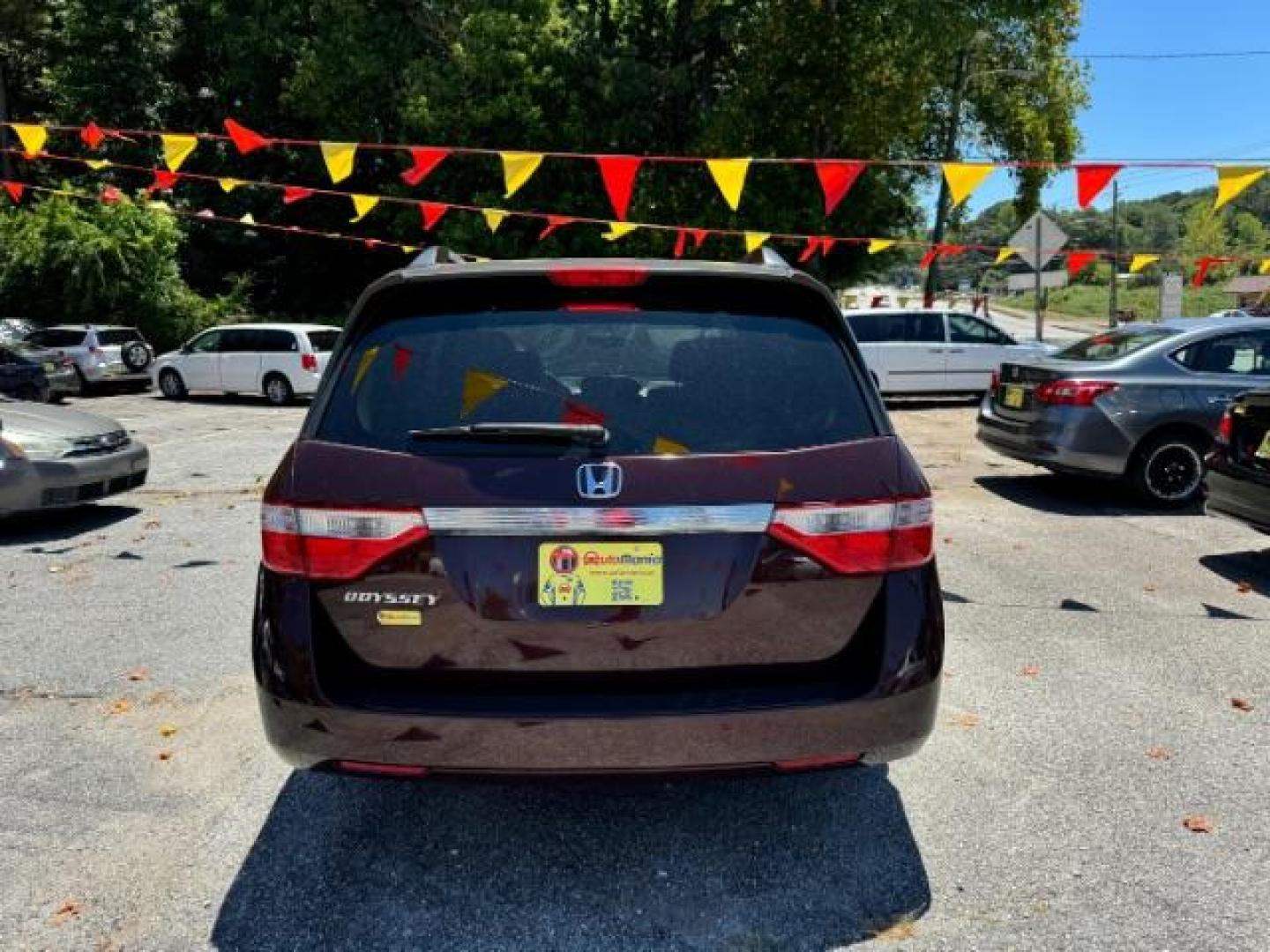 2012 Maroon Honda Odyssey EX (5FNRL5H44CB) with an 3.5L V6 SOHC 24V engine, 5-Speed Automatic transmission, located at 1806 Veterans Memorial Hwy SW, Austell, GA, 30168, (770) 944-9558, 33.817959, -84.606987 - Photo#4