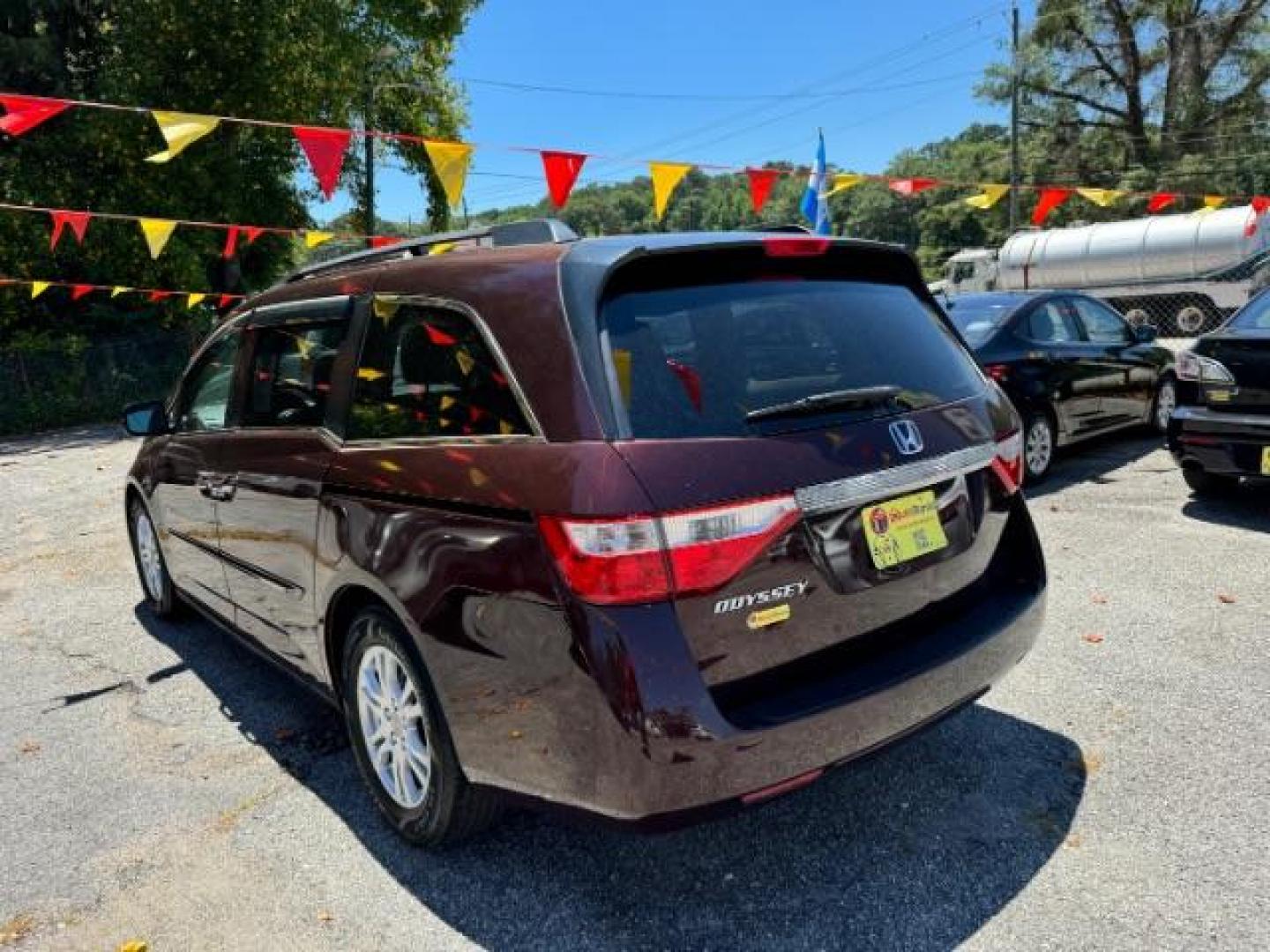 2012 Maroon Honda Odyssey EX (5FNRL5H44CB) with an 3.5L V6 SOHC 24V engine, 5-Speed Automatic transmission, located at 1806 Veterans Memorial Hwy SW, Austell, GA, 30168, (770) 944-9558, 33.817959, -84.606987 - Photo#5