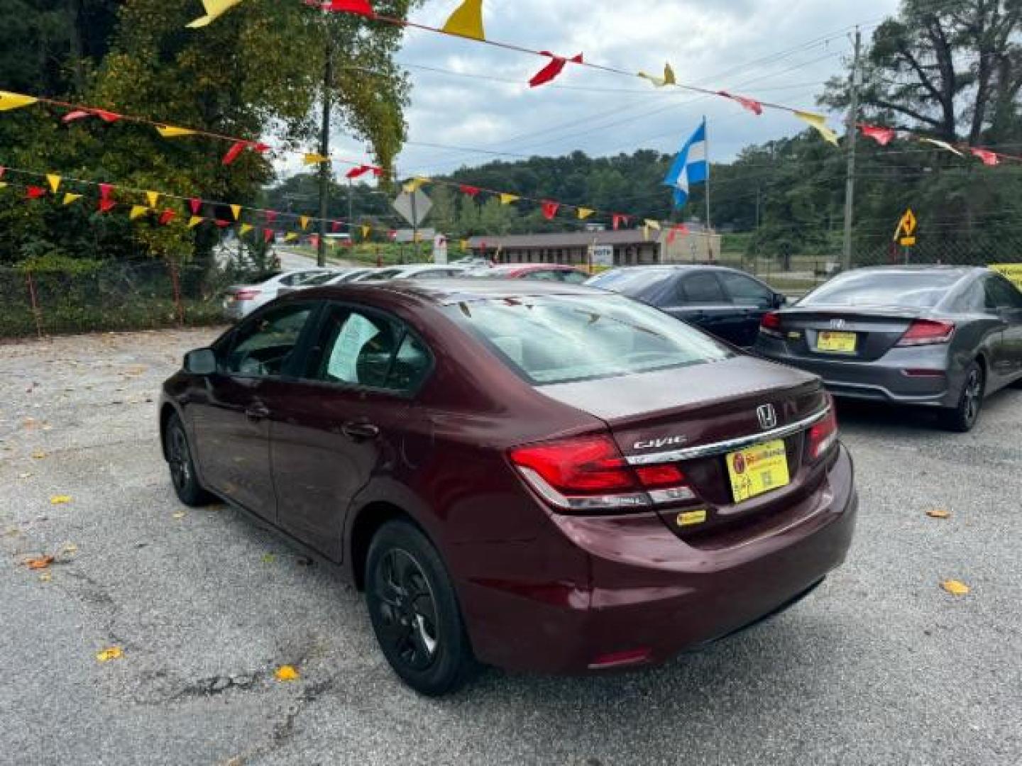 2013 Burgundy Honda Civic LX Sedan 5-Speed AT (19XFB2F59DE) with an 1.8L L4 SOHC 16V engine, 5-Speed Automatic transmission, located at 1806 Veterans Memorial Hwy SW, Austell, GA, 30168, (770) 944-9558, 33.817959, -84.606987 - Photo#5