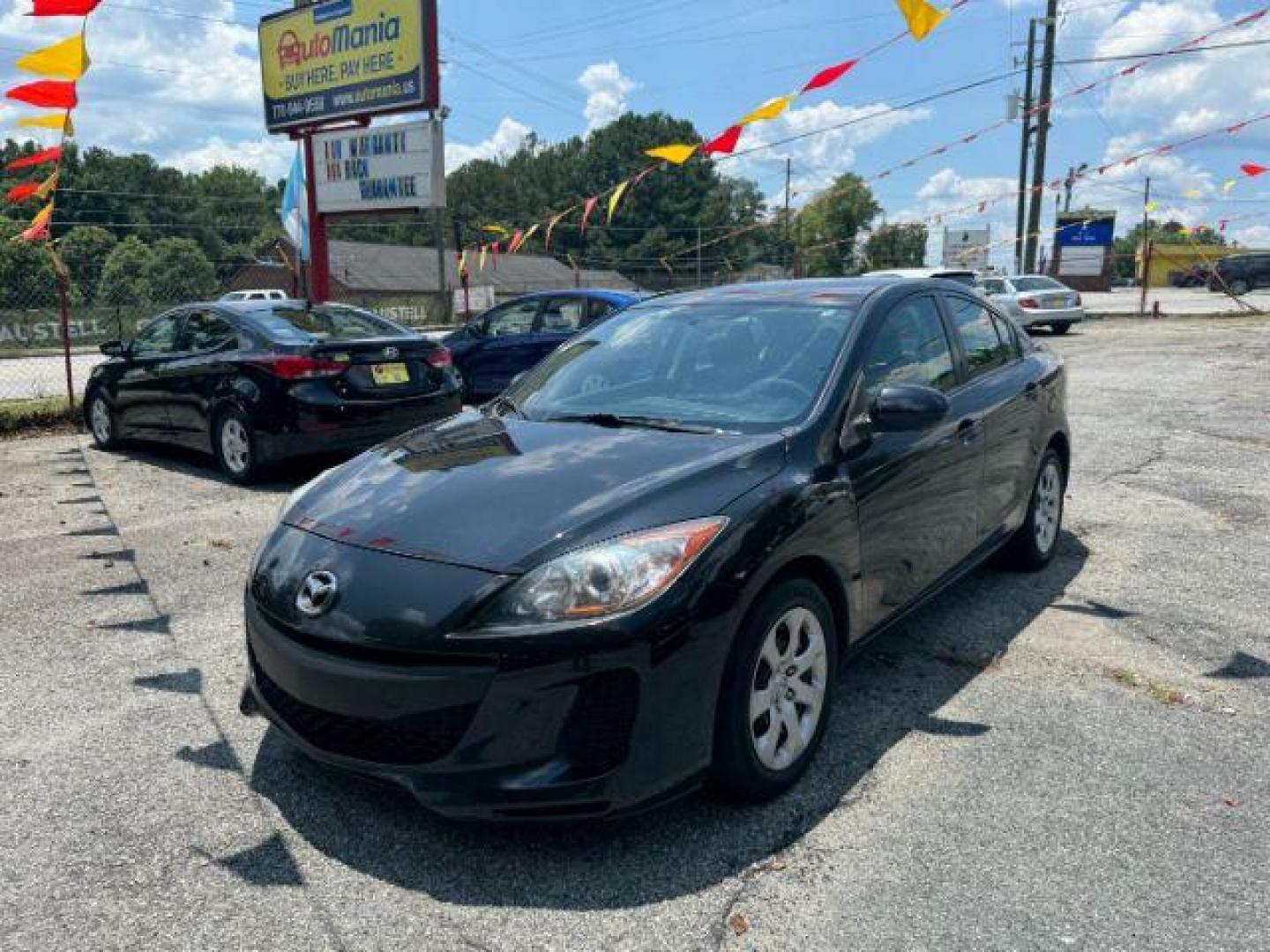 2013 Black Mazda MAZDA3 i SV AT 4-Door (JM1BL1TF3D1) with an 2.0L L4 DOHC 16V engine, 5-Speed Automatic transmission, located at 1806 Veterans Memorial Hwy SW, Austell, GA, 30168, (770) 944-9558, 33.817959, -84.606987 - Photo#0