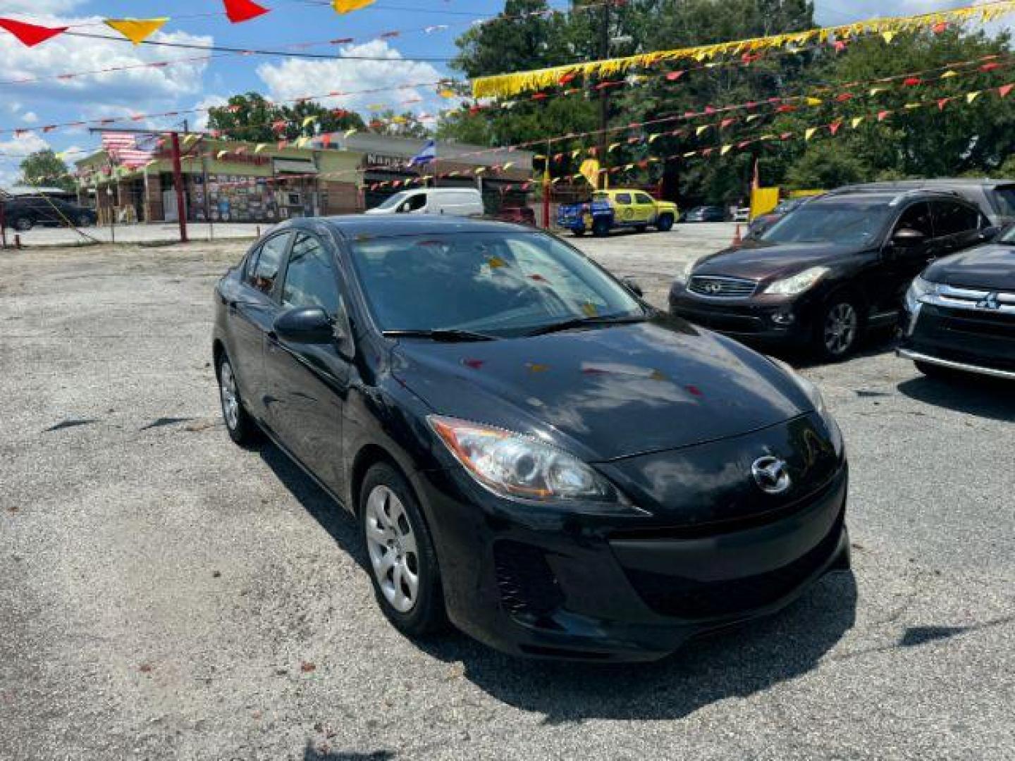 2013 Black Mazda MAZDA3 i SV AT 4-Door (JM1BL1TF3D1) with an 2.0L L4 DOHC 16V engine, 5-Speed Automatic transmission, located at 1806 Veterans Memorial Hwy SW, Austell, GA, 30168, (770) 944-9558, 33.817959, -84.606987 - Photo#3