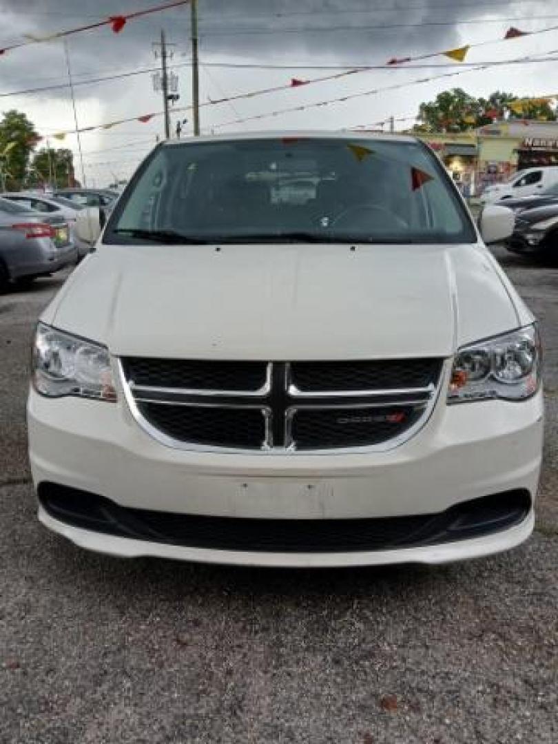 2013 White Dodge Grand Caravan SXT (2C4RDGCG2DR) with an 3.6L V6 DOHC 24V engine, 6-Speed Automatic transmission, located at 1806 Veterans Memorial Hwy SW, Austell, GA, 30168, (770) 944-9558, 33.817959, -84.606987 - Photo#1