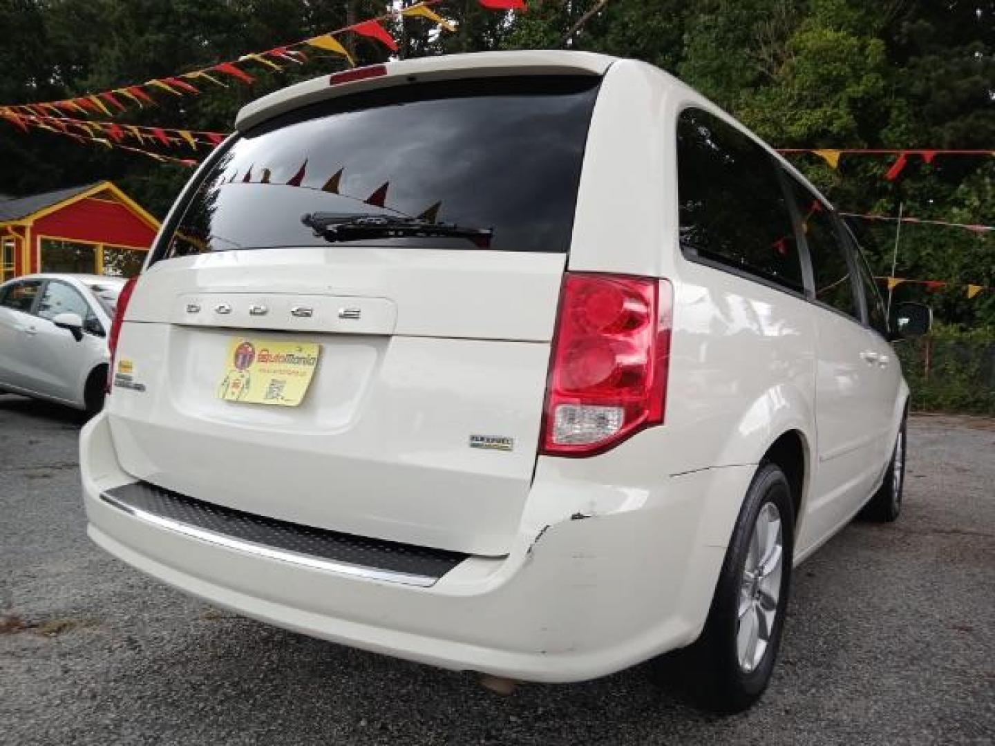 2013 White Dodge Grand Caravan SXT (2C4RDGCG2DR) with an 3.6L V6 DOHC 24V engine, 6-Speed Automatic transmission, located at 1806 Veterans Memorial Hwy SW, Austell, GA, 30168, (770) 944-9558, 33.817959, -84.606987 - Photo#3