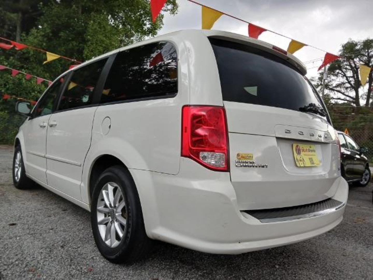 2013 White Dodge Grand Caravan SXT (2C4RDGCG2DR) with an 3.6L V6 DOHC 24V engine, 6-Speed Automatic transmission, located at 1806 Veterans Memorial Hwy SW, Austell, GA, 30168, (770) 944-9558, 33.817959, -84.606987 - Photo#6