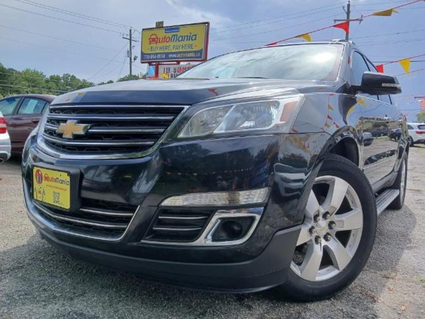 2014 Black Chevrolet Traverse LTZ AWD (1GNKVJKD0EJ) with an 3.6L V6 DOHC 24V engine, 6-Speed Automatic transmission, located at 1806 Veterans Memorial Hwy SW, Austell, GA, 30168, (770) 944-9558, 33.817959, -84.606987 - Photo#2