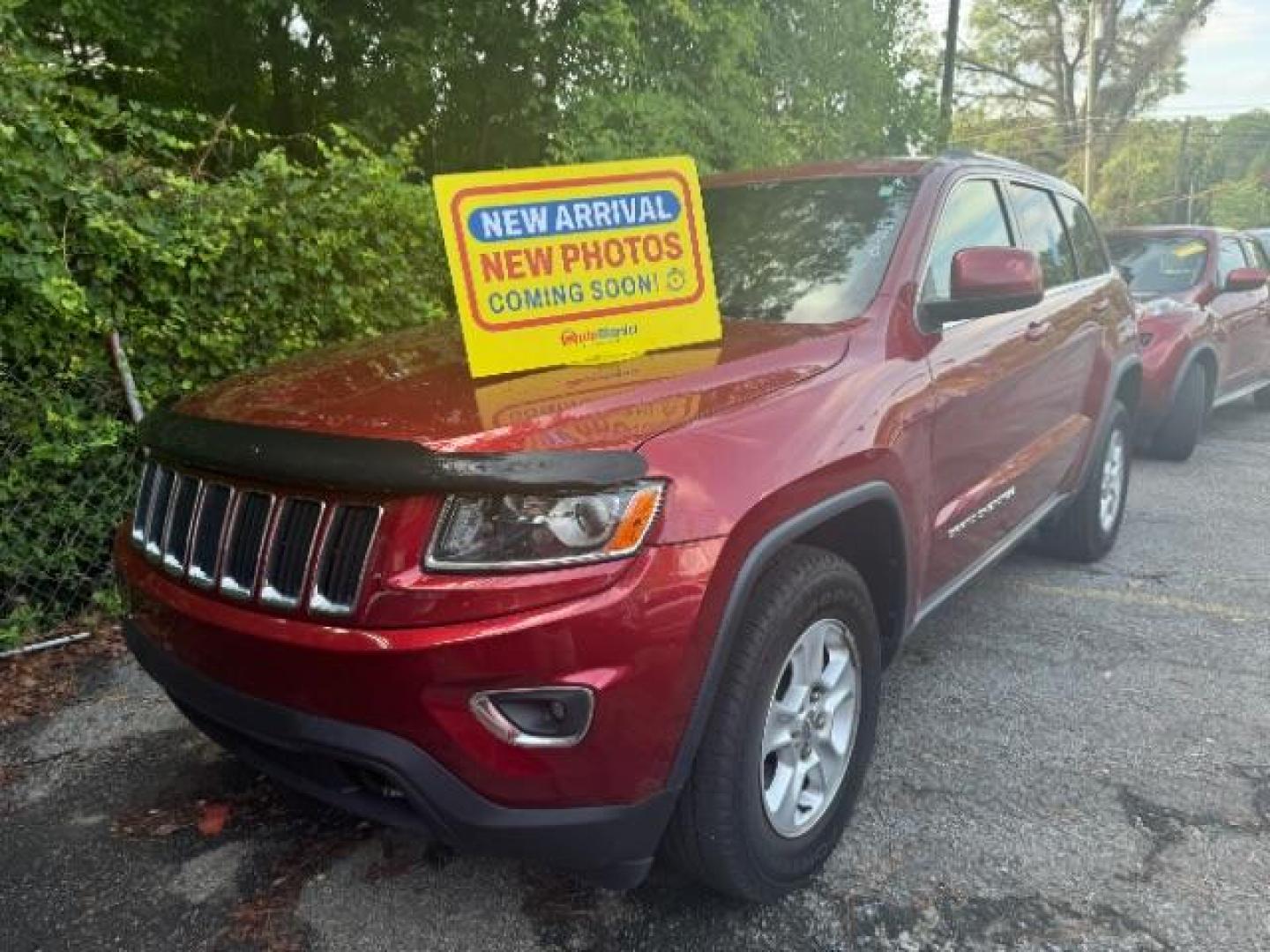 2014 Red Jeep Grand Cherokee SPORT UTILITY 4-DR (1C4RJEAG9EC) with an 3.6L V6 DOHC 24V engine, 5-Speed Automatic transmission, located at 1806 Veterans Memorial Hwy SW, Austell, GA, 30168, (770) 944-9558, 33.817959, -84.606987 - Photo#0