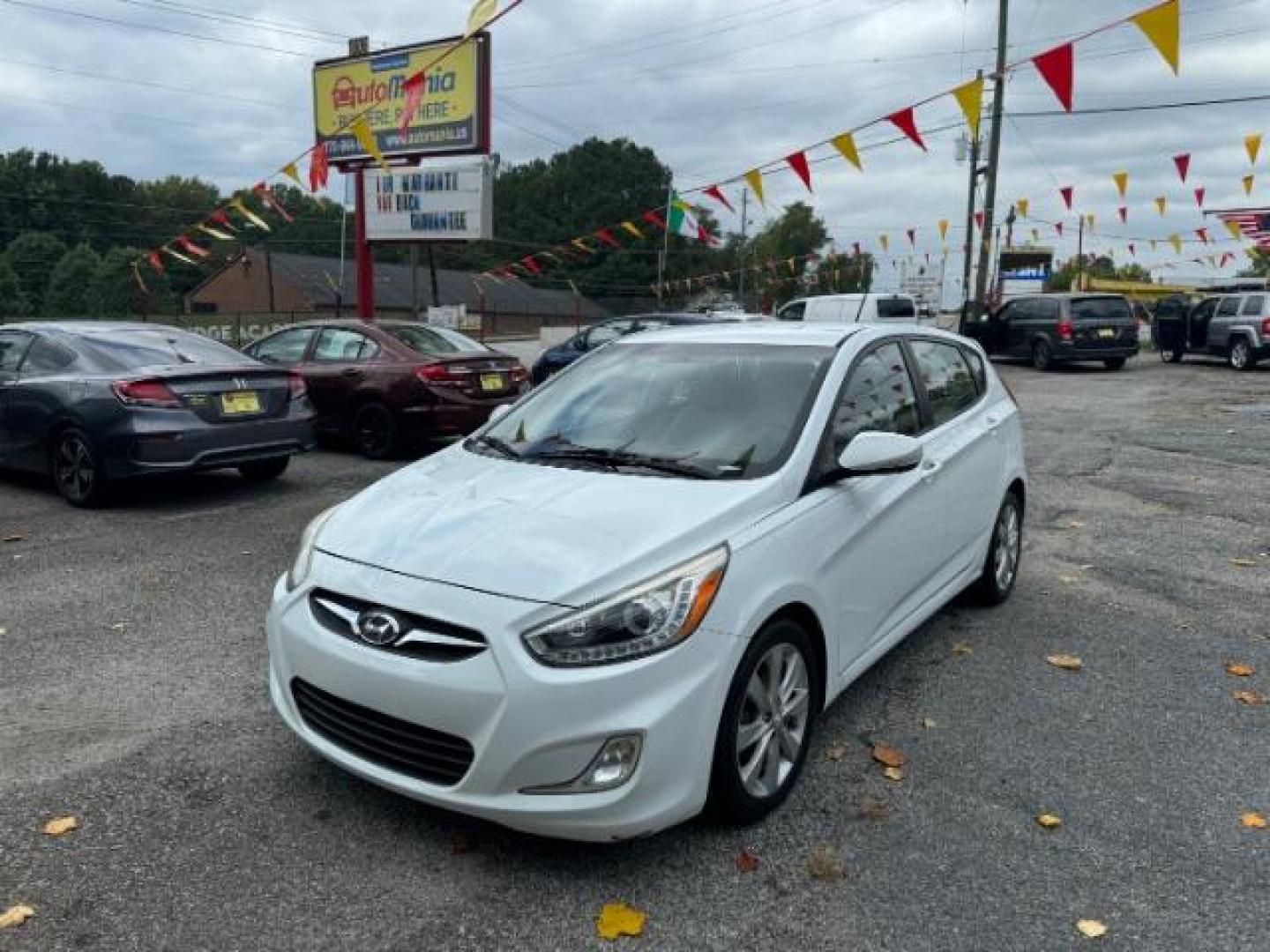 2014 White Hyundai Accent SE 5-Door (KMHCU5AE2EU) with an 1.6L L4 DOHC 16V engine, located at 1806 Veterans Memorial Hwy SW, Austell, GA, 30168, (770) 944-9558, 33.817959, -84.606987 - Photo#0