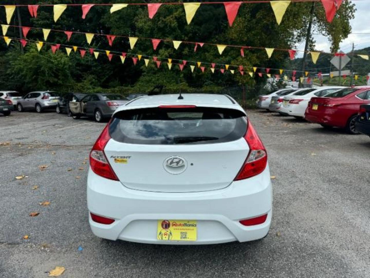 2014 White Hyundai Accent SE 5-Door (KMHCU5AE2EU) with an 1.6L L4 DOHC 16V engine, located at 1806 Veterans Memorial Hwy SW, Austell, GA, 30168, (770) 944-9558, 33.817959, -84.606987 - Photo#4