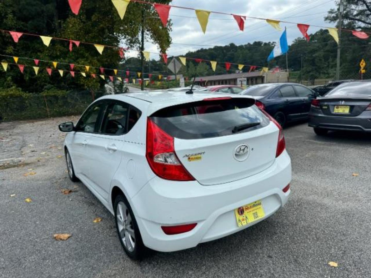 2014 White Hyundai Accent SE 5-Door (KMHCU5AE2EU) with an 1.6L L4 DOHC 16V engine, located at 1806 Veterans Memorial Hwy SW, Austell, GA, 30168, (770) 944-9558, 33.817959, -84.606987 - Photo#5