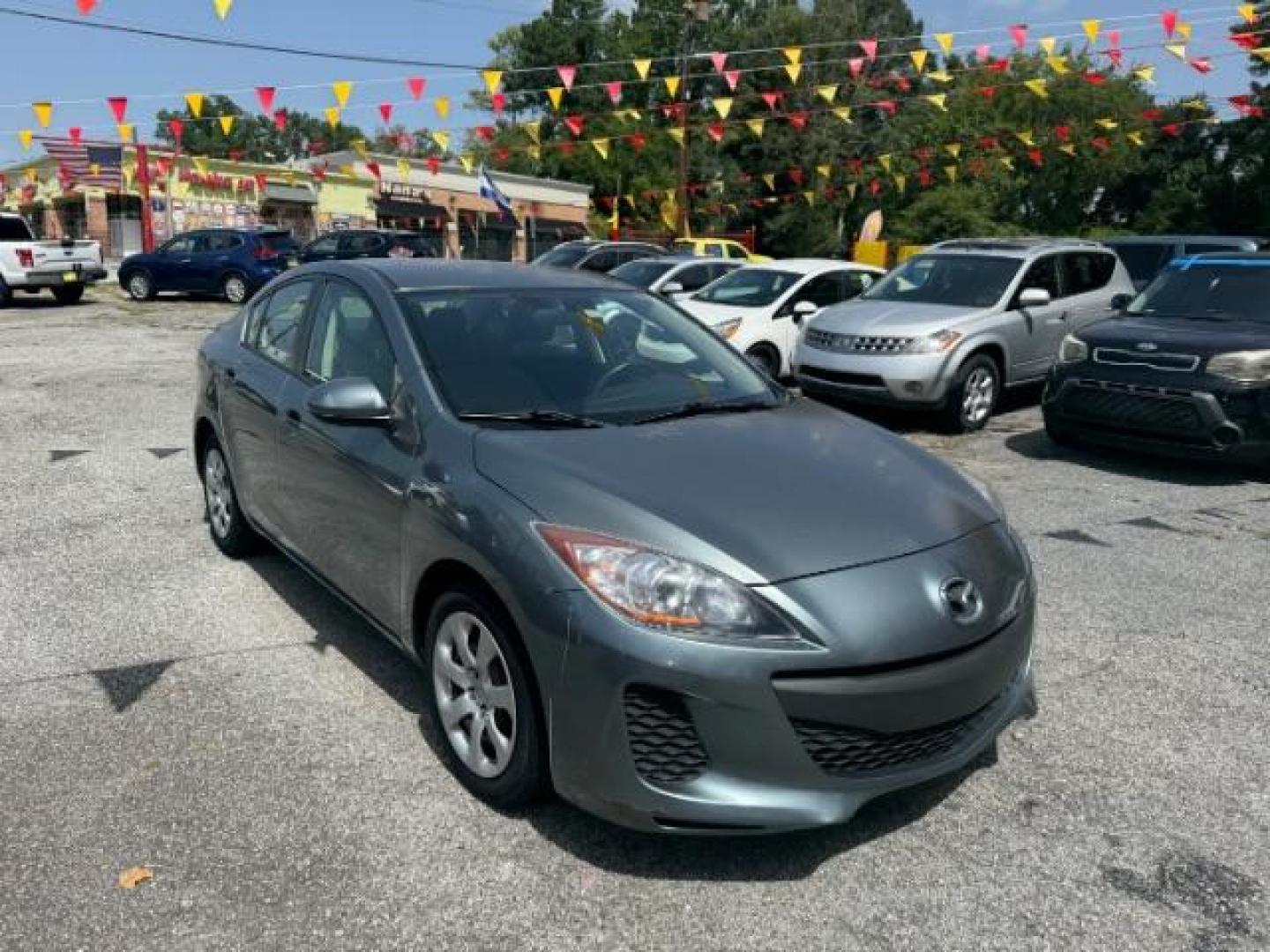 2013 Gray Mazda MAZDA3 i SV AT 4-Door (JM1BL1TF5D1) with an 2.0L L4 DOHC 16V engine, 5-Speed Automatic transmission, located at 1806 Veterans Memorial Hwy SW, Austell, GA, 30168, (770) 944-9558, 33.817959, -84.606987 - Photo#2