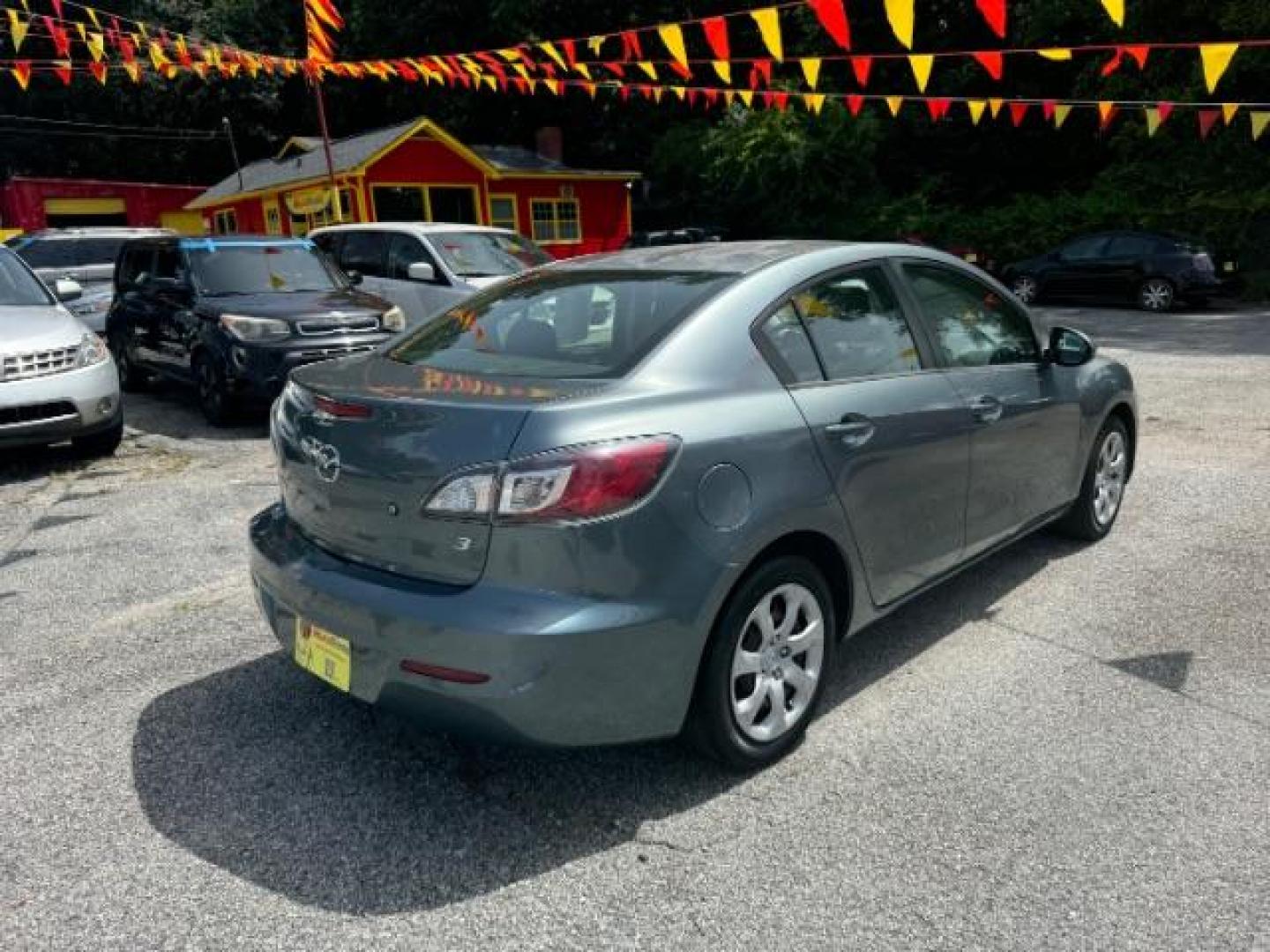 2013 Gray Mazda MAZDA3 i SV AT 4-Door (JM1BL1TF5D1) with an 2.0L L4 DOHC 16V engine, 5-Speed Automatic transmission, located at 1806 Veterans Memorial Hwy SW, Austell, GA, 30168, (770) 944-9558, 33.817959, -84.606987 - Photo#3