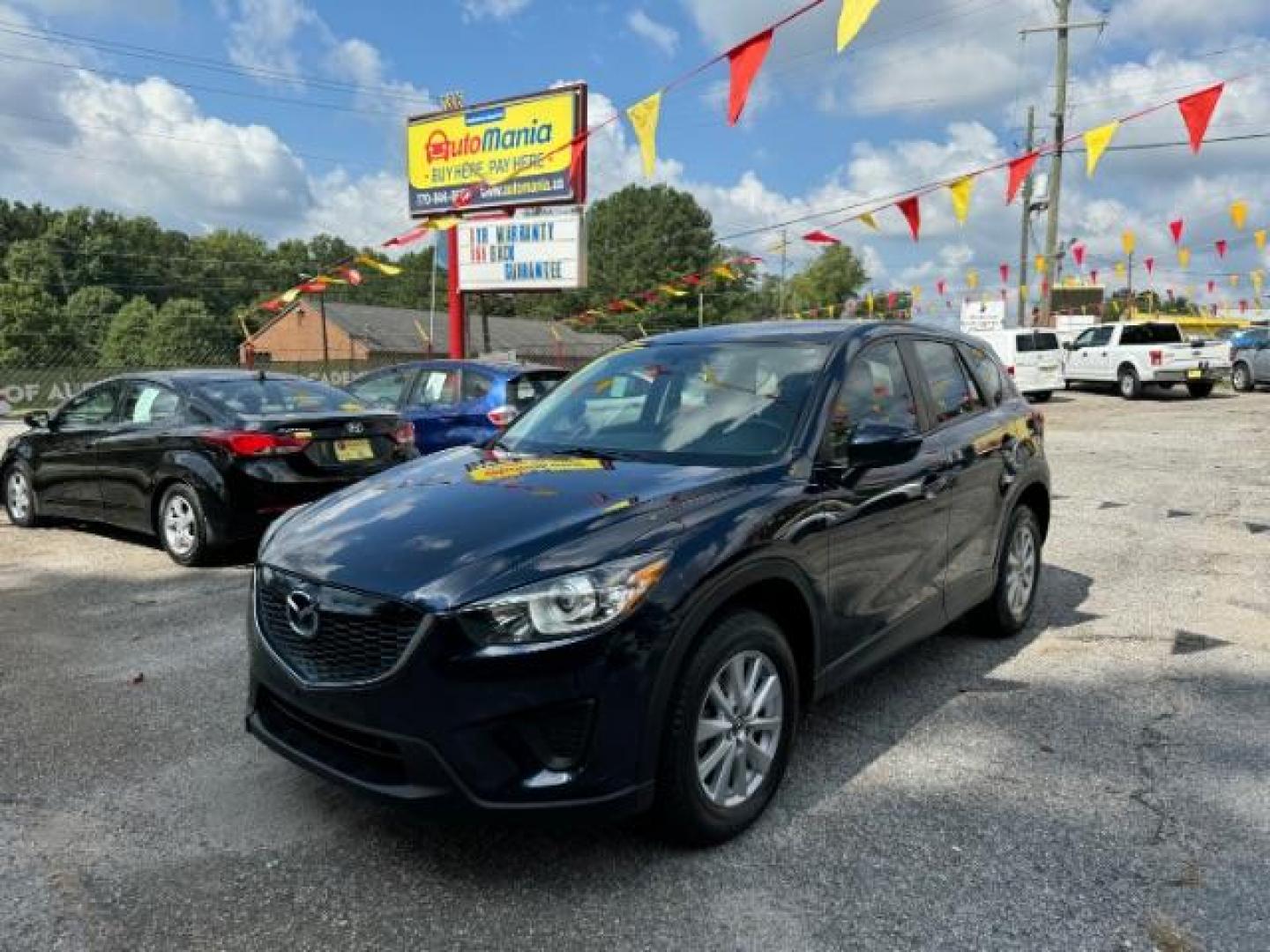 2015 Blue Mazda CX-5 Sport AT (JM3KE2BE4F0) with an 2.0L L4 DOHC 16V engine, 6-Speed Automatic transmission, located at 1806 Veterans Memorial Hwy SW, Austell, GA, 30168, (770) 944-9558, 33.817959, -84.606987 - Photo#0