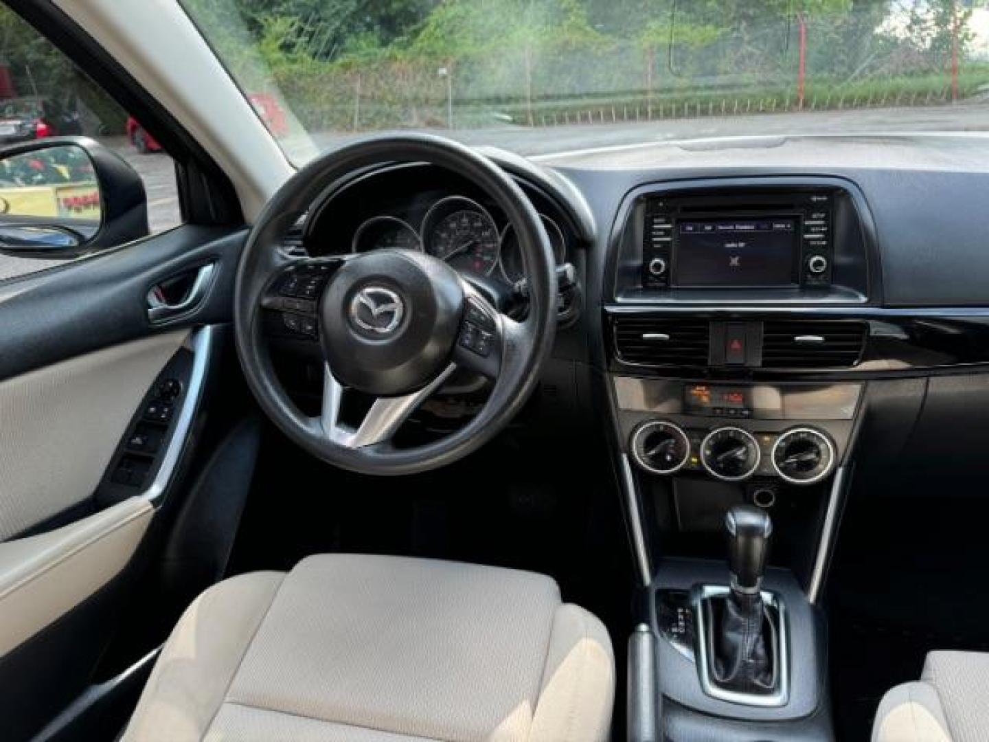 2015 Blue Mazda CX-5 Sport AT (JM3KE2BE4F0) with an 2.0L L4 DOHC 16V engine, 6-Speed Automatic transmission, located at 1806 Veterans Memorial Hwy SW, Austell, GA, 30168, (770) 944-9558, 33.817959, -84.606987 - Photo#12