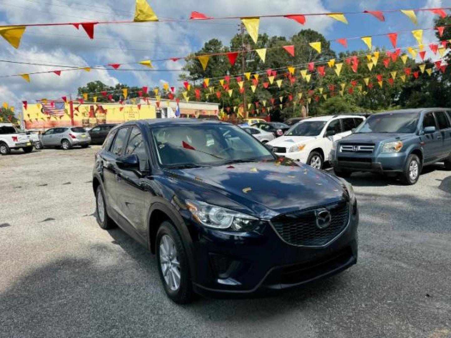 2015 Blue Mazda CX-5 Sport AT (JM3KE2BE4F0) with an 2.0L L4 DOHC 16V engine, 6-Speed Automatic transmission, located at 1806 Veterans Memorial Hwy SW, Austell, GA, 30168, (770) 944-9558, 33.817959, -84.606987 - Photo#2