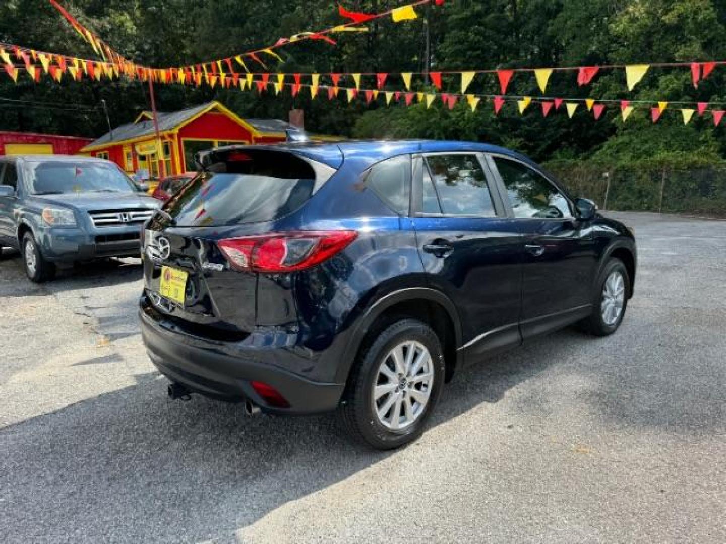 2015 Blue Mazda CX-5 Sport AT (JM3KE2BE4F0) with an 2.0L L4 DOHC 16V engine, 6-Speed Automatic transmission, located at 1806 Veterans Memorial Hwy SW, Austell, GA, 30168, (770) 944-9558, 33.817959, -84.606987 - Photo#3