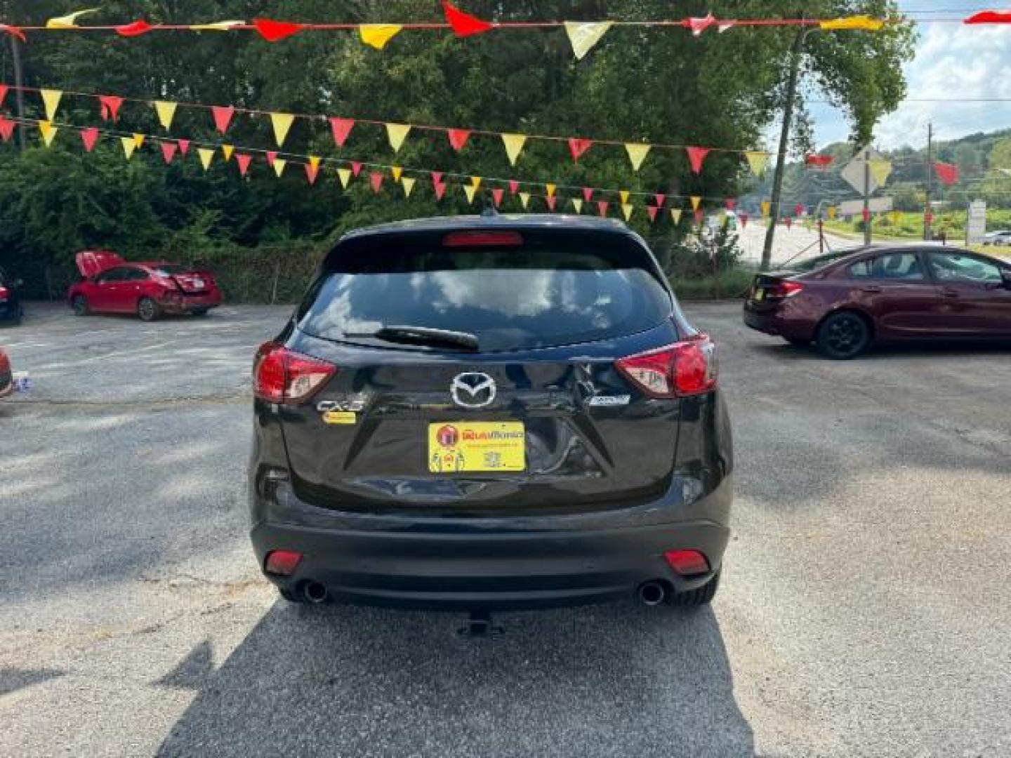 2015 Blue Mazda CX-5 Sport AT (JM3KE2BE4F0) with an 2.0L L4 DOHC 16V engine, 6-Speed Automatic transmission, located at 1806 Veterans Memorial Hwy SW, Austell, GA, 30168, (770) 944-9558, 33.817959, -84.606987 - Photo#4