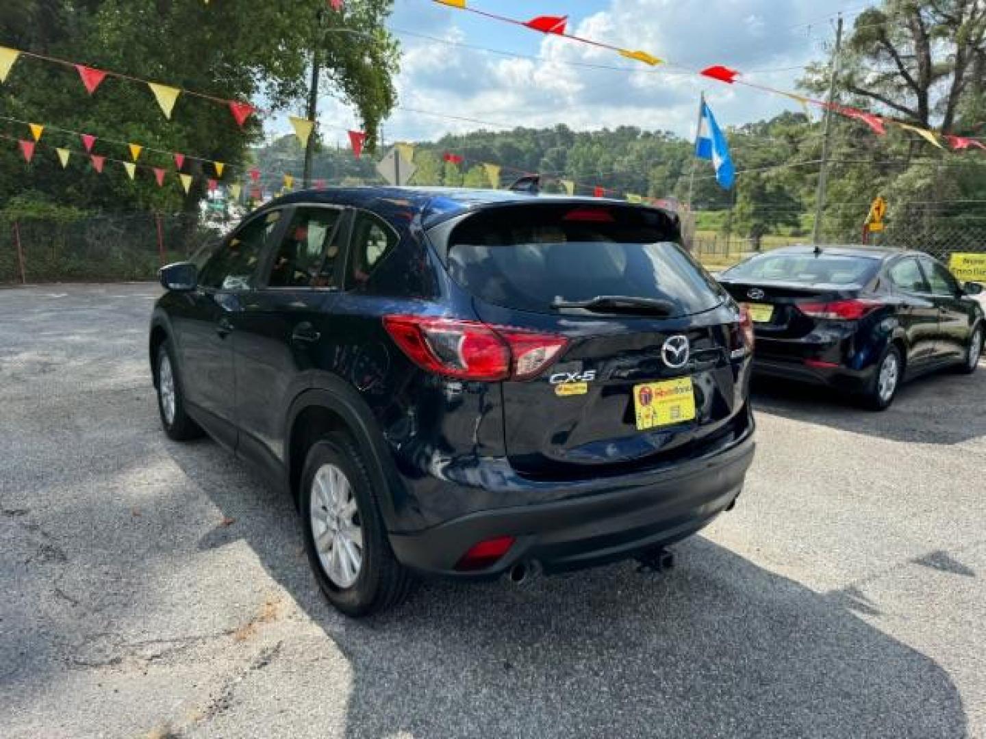 2015 Blue Mazda CX-5 Sport AT (JM3KE2BE4F0) with an 2.0L L4 DOHC 16V engine, 6-Speed Automatic transmission, located at 1806 Veterans Memorial Hwy SW, Austell, GA, 30168, (770) 944-9558, 33.817959, -84.606987 - Photo#5