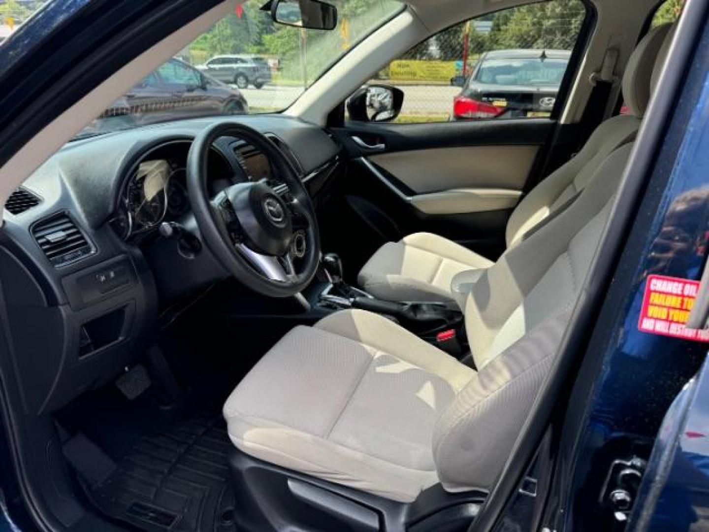 2015 Blue Mazda CX-5 Sport AT (JM3KE2BE4F0) with an 2.0L L4 DOHC 16V engine, 6-Speed Automatic transmission, located at 1806 Veterans Memorial Hwy SW, Austell, GA, 30168, (770) 944-9558, 33.817959, -84.606987 - Photo#6