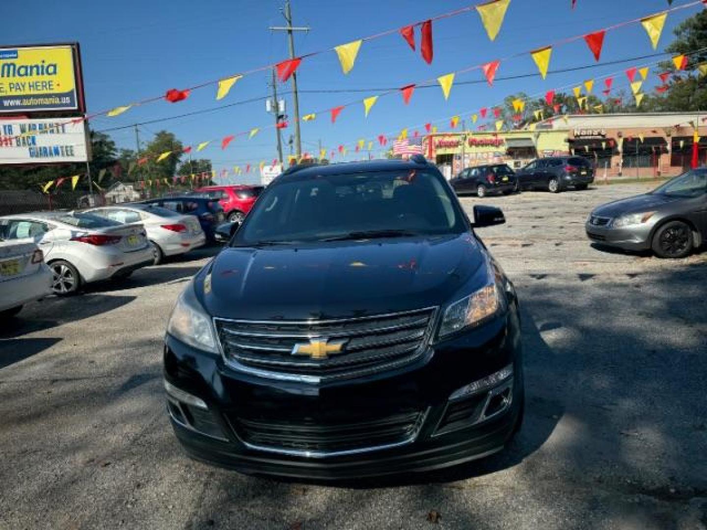 2016 Black Chevrolet Traverse 1LT FWD (1GNKRGKD0GJ) with an 3.6L V6 DOHC 24V engine, 6-Speed Automatic transmission, located at 1806 Veterans Memorial Hwy SW, Austell, GA, 30168, (770) 944-9558, 33.817959, -84.606987 - Photo#1