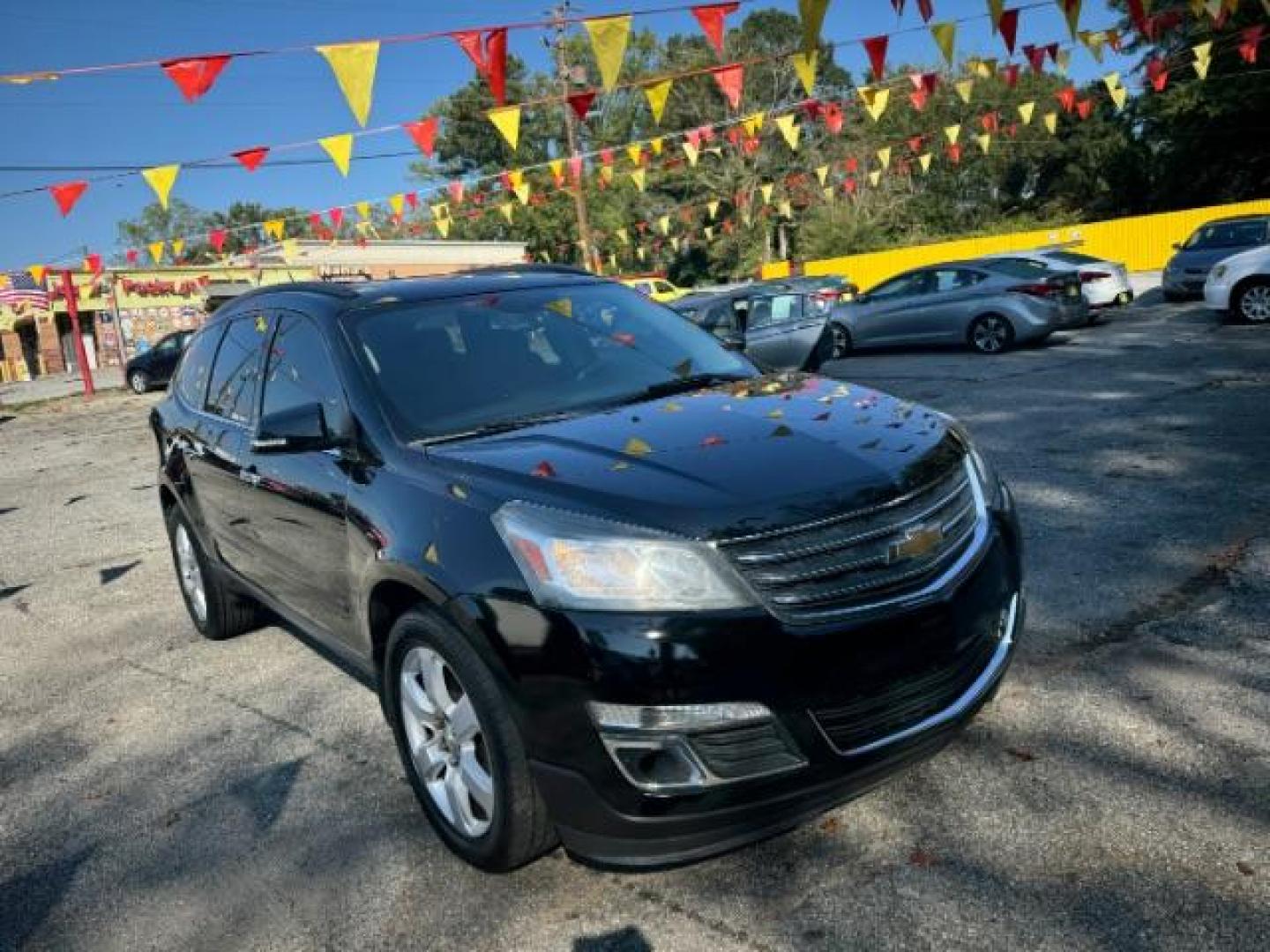 2016 Black Chevrolet Traverse 1LT FWD (1GNKRGKD0GJ) with an 3.6L V6 DOHC 24V engine, 6-Speed Automatic transmission, located at 1806 Veterans Memorial Hwy SW, Austell, GA, 30168, (770) 944-9558, 33.817959, -84.606987 - Photo#2