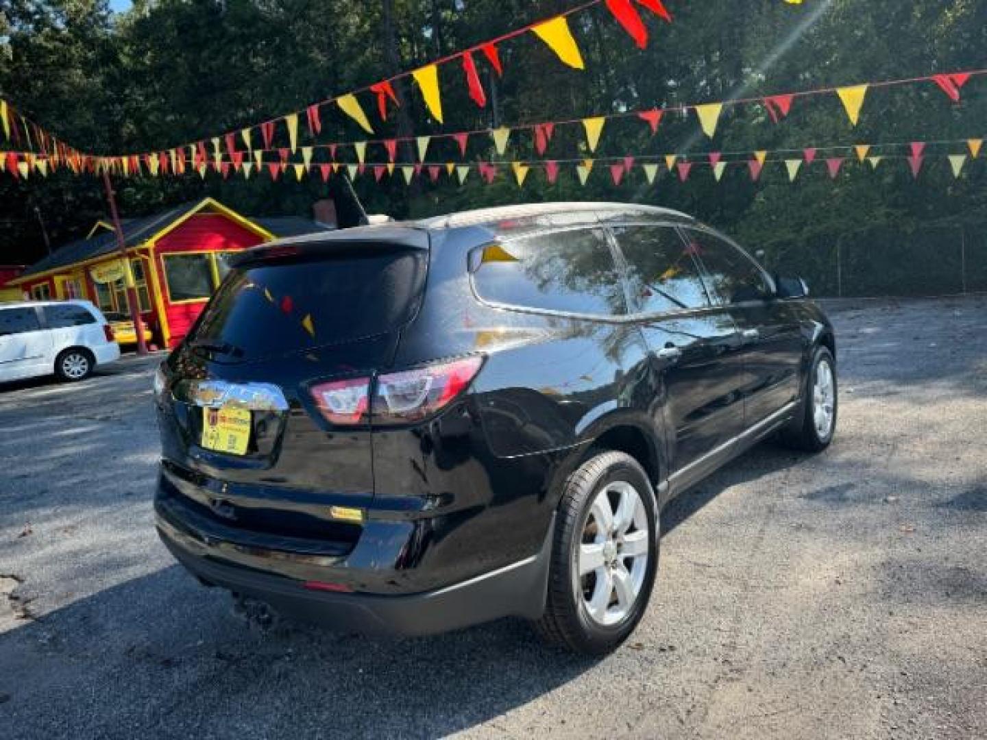 2016 Black Chevrolet Traverse 1LT FWD (1GNKRGKD0GJ) with an 3.6L V6 DOHC 24V engine, 6-Speed Automatic transmission, located at 1806 Veterans Memorial Hwy SW, Austell, GA, 30168, (770) 944-9558, 33.817959, -84.606987 - Photo#3