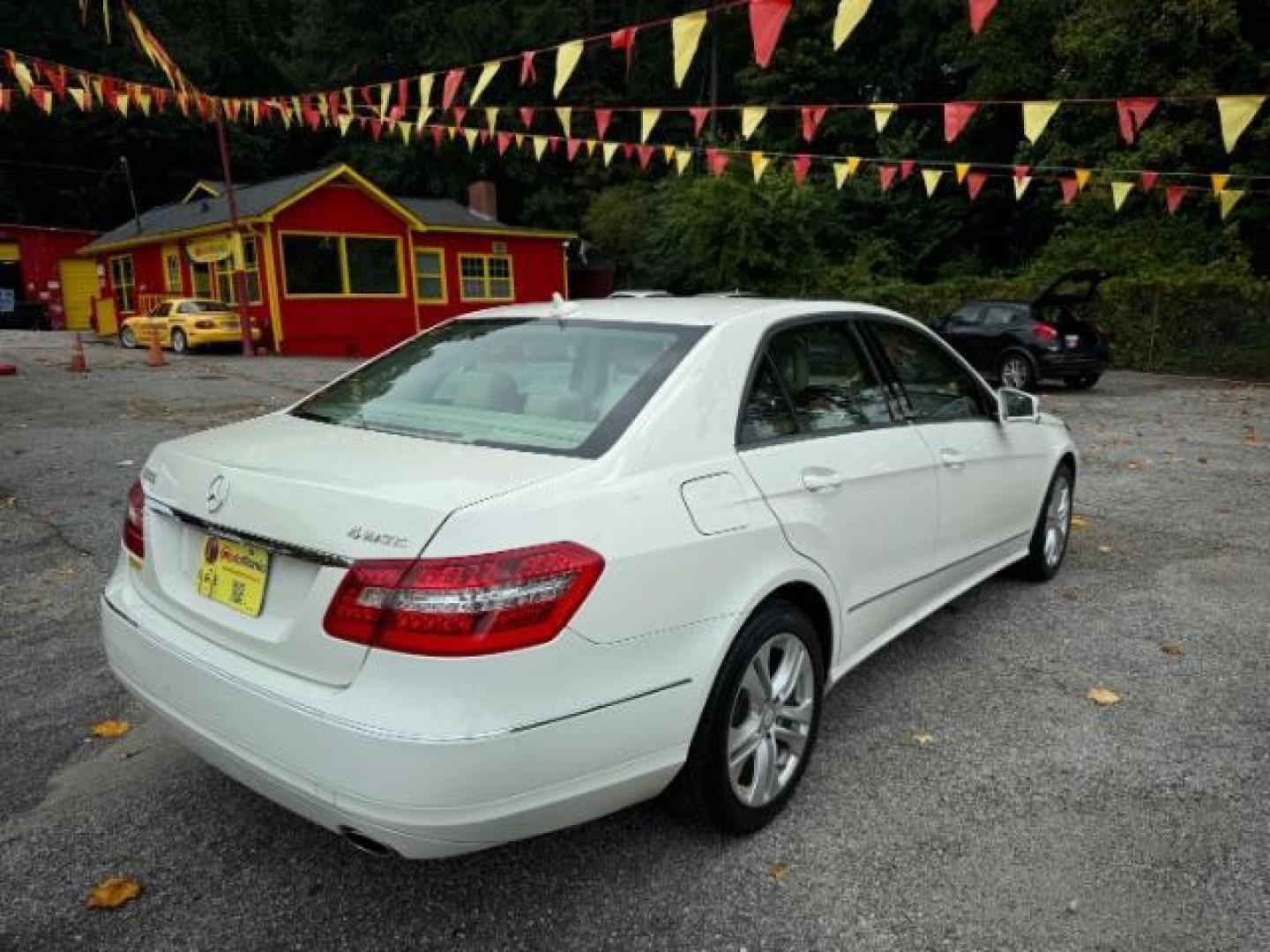 2011 White Mercedes-Benz E-Class E350 Sedan 4MATIC (WDDHF8HB0BA) with an 3.5L V6 DOHC 24V engine, 7-Speed Automatic transmission, located at 1806 Veterans Memorial Hwy SW, Austell, GA, 30168, (770) 944-9558, 33.817959, -84.606987 - Photo#2