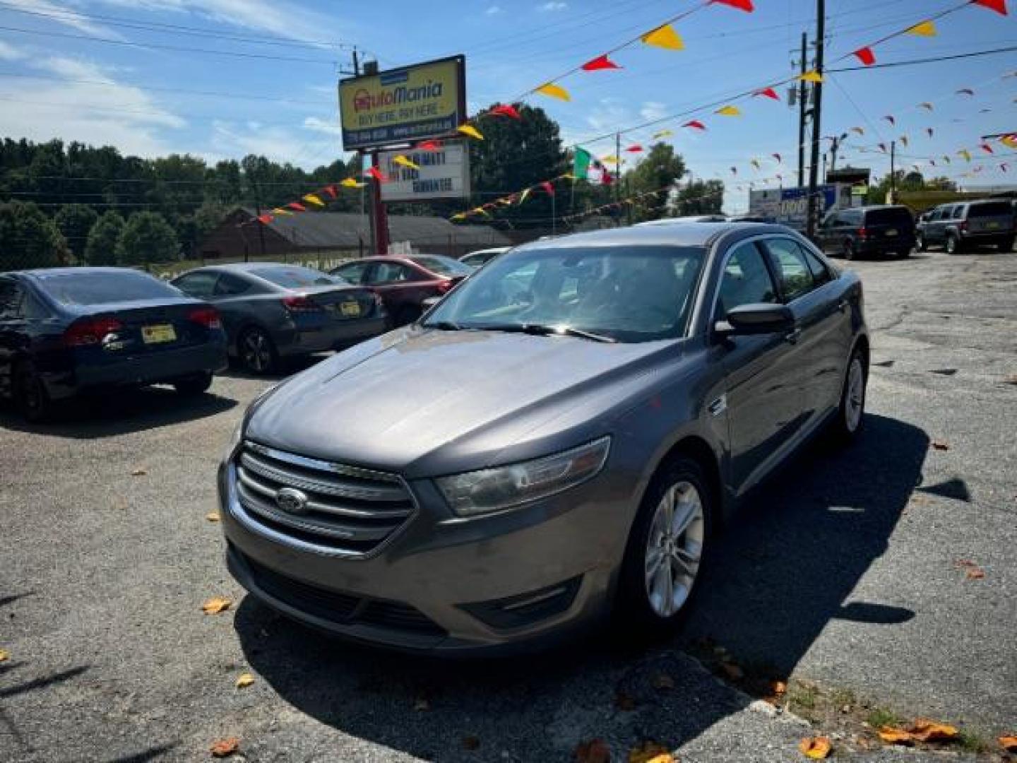 2013 Gray Ford Taurus SEL FWD (1FAHP2E8XDG) with an 3.5L V6 DOHC 24V engine, 6-Speed Automatic transmission, located at 1806 Veterans Memorial Hwy SW, Austell, GA, 30168, (770) 944-9558, 33.817959, -84.606987 - Photo#0