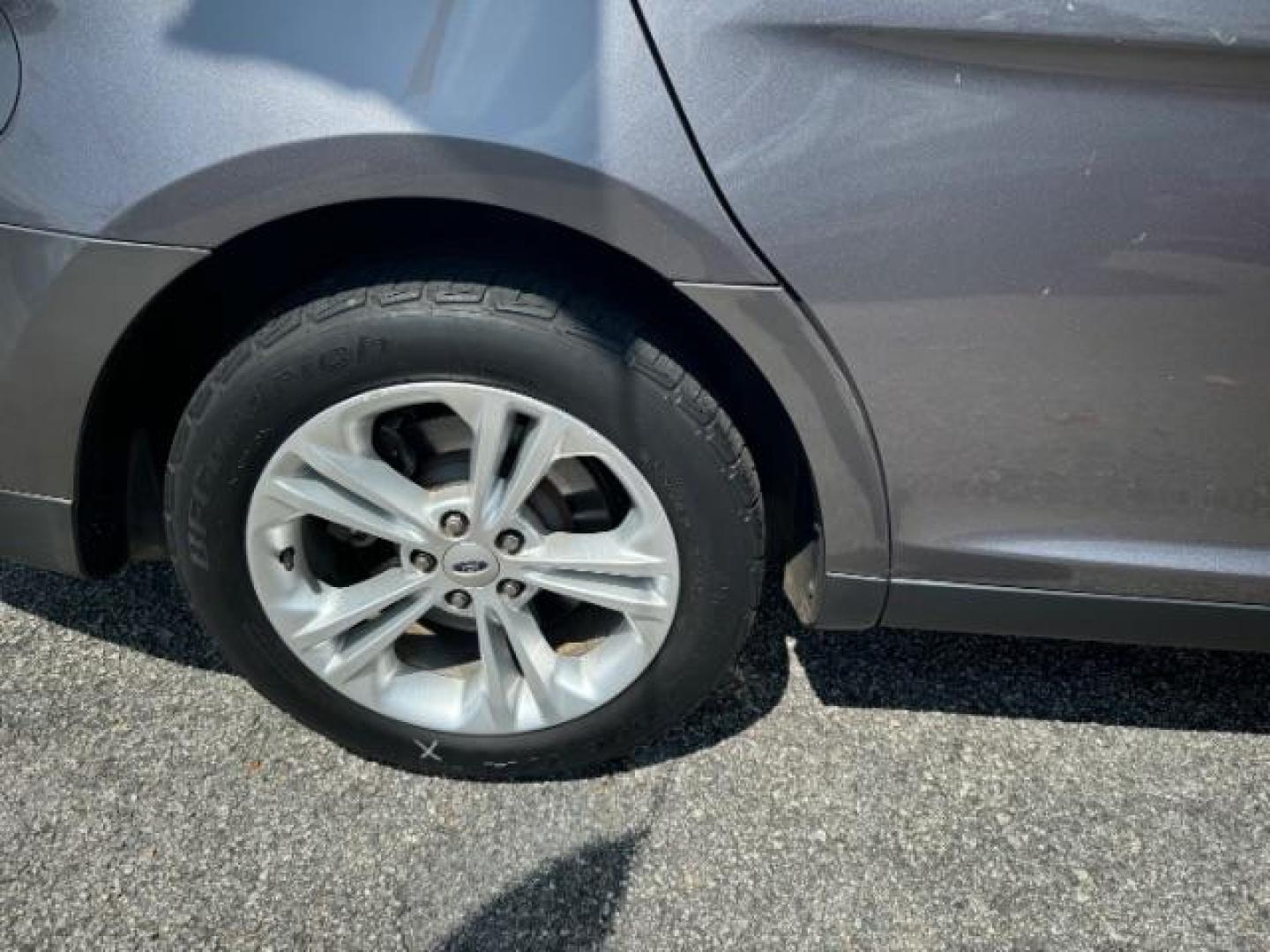 2013 Gray Ford Taurus SEL FWD (1FAHP2E8XDG) with an 3.5L V6 DOHC 24V engine, 6-Speed Automatic transmission, located at 1806 Veterans Memorial Hwy SW, Austell, GA, 30168, (770) 944-9558, 33.817959, -84.606987 - Photo#20