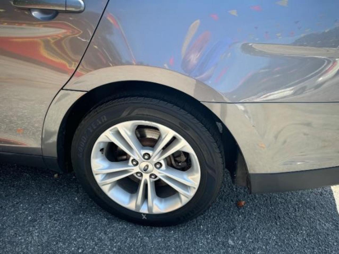 2013 Gray Ford Taurus SEL FWD (1FAHP2E8XDG) with an 3.5L V6 DOHC 24V engine, 6-Speed Automatic transmission, located at 1806 Veterans Memorial Hwy SW, Austell, GA, 30168, (770) 944-9558, 33.817959, -84.606987 - Photo#21