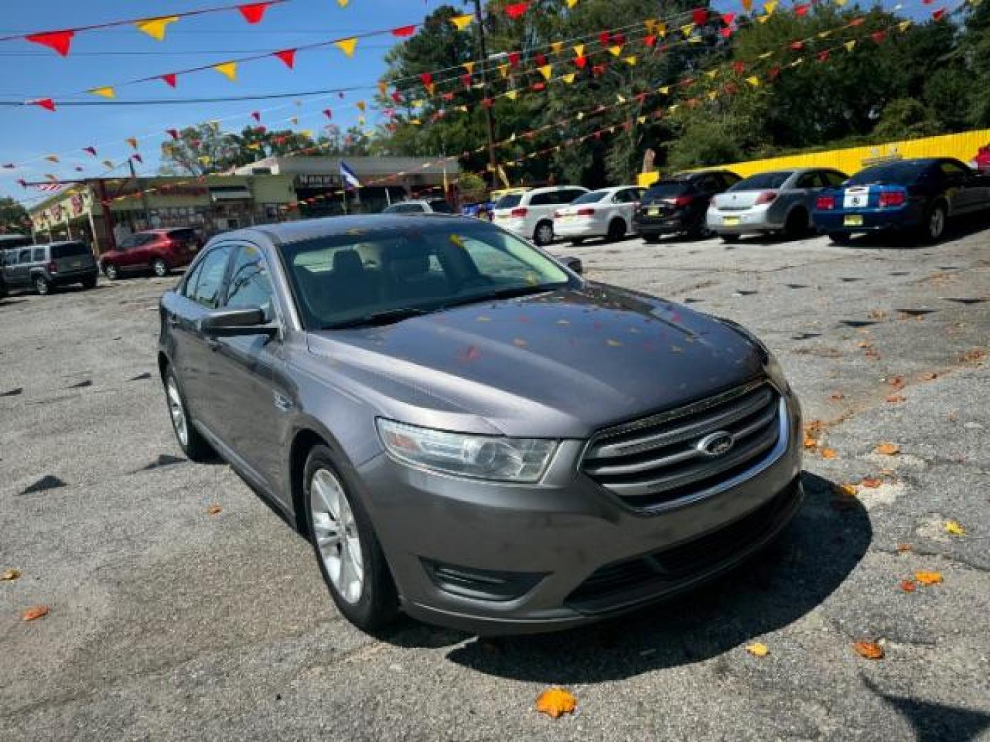 2013 Gray Ford Taurus SEL FWD (1FAHP2E8XDG) with an 3.5L V6 DOHC 24V engine, 6-Speed Automatic transmission, located at 1806 Veterans Memorial Hwy SW, Austell, GA, 30168, (770) 944-9558, 33.817959, -84.606987 - Photo#2