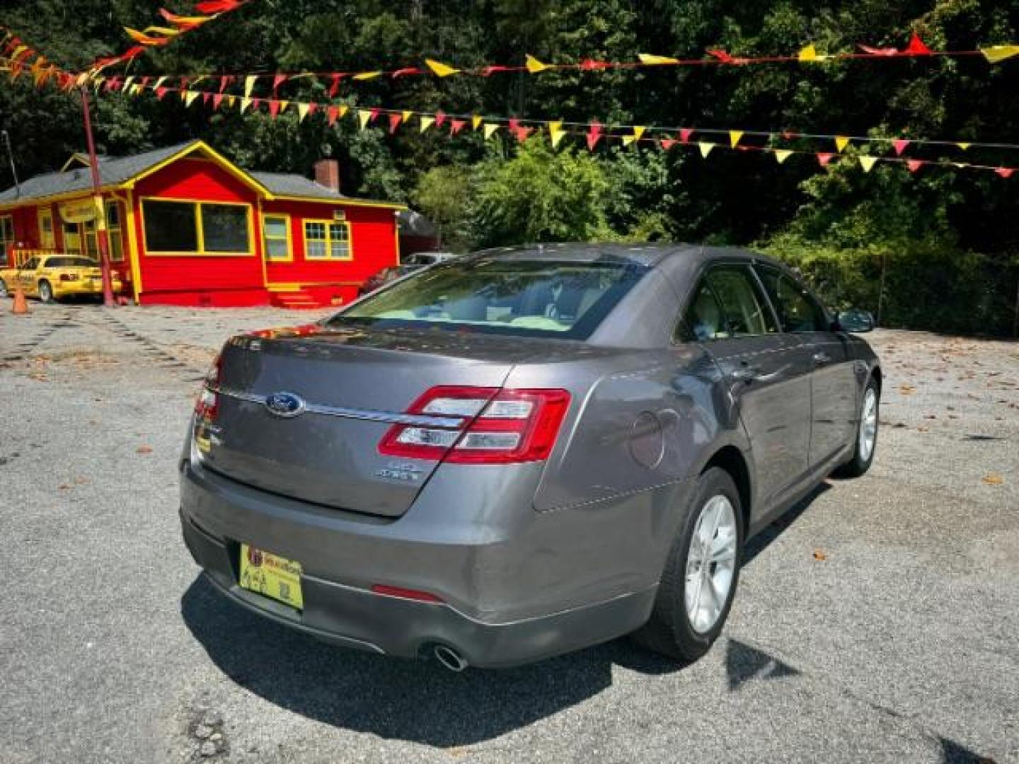 2013 Gray Ford Taurus SEL FWD (1FAHP2E8XDG) with an 3.5L V6 DOHC 24V engine, 6-Speed Automatic transmission, located at 1806 Veterans Memorial Hwy SW, Austell, GA, 30168, (770) 944-9558, 33.817959, -84.606987 - Photo#3