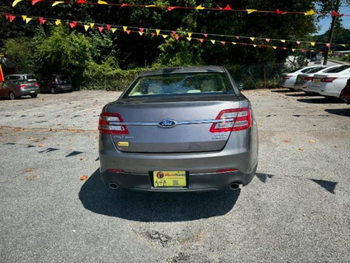 2013 Gray Ford Taurus SEL FWD (1FAHP2E8XDG) with an 3.5L V6 DOHC 24V engine, 6-Speed Automatic transmission, located at 1806 Veterans Memorial Hwy SW, Austell, GA, 30168, (770) 944-9558, 33.817959, -84.606987 - Photo#4