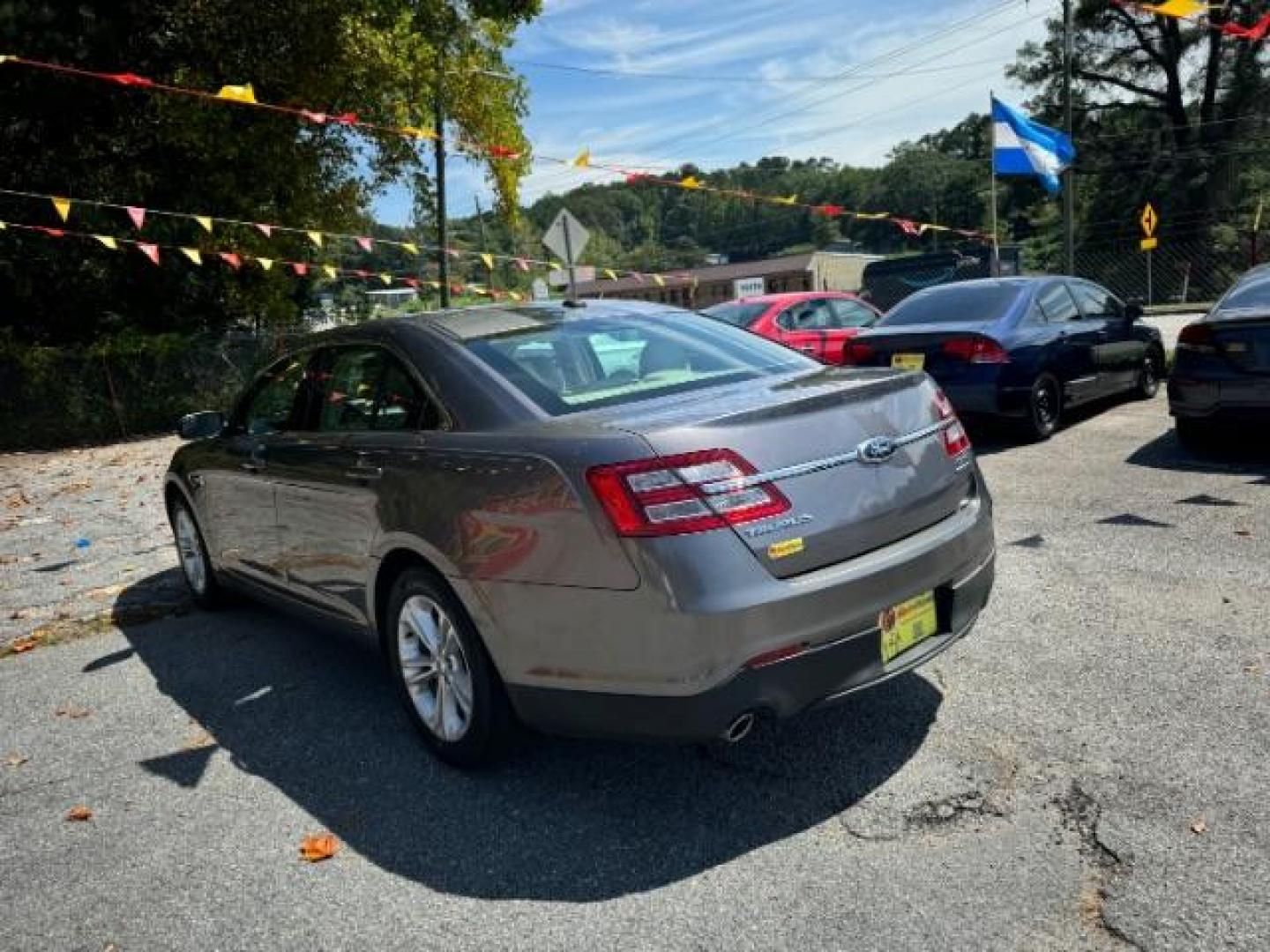 2013 Gray Ford Taurus SEL FWD (1FAHP2E8XDG) with an 3.5L V6 DOHC 24V engine, 6-Speed Automatic transmission, located at 1806 Veterans Memorial Hwy SW, Austell, GA, 30168, (770) 944-9558, 33.817959, -84.606987 - Photo#5